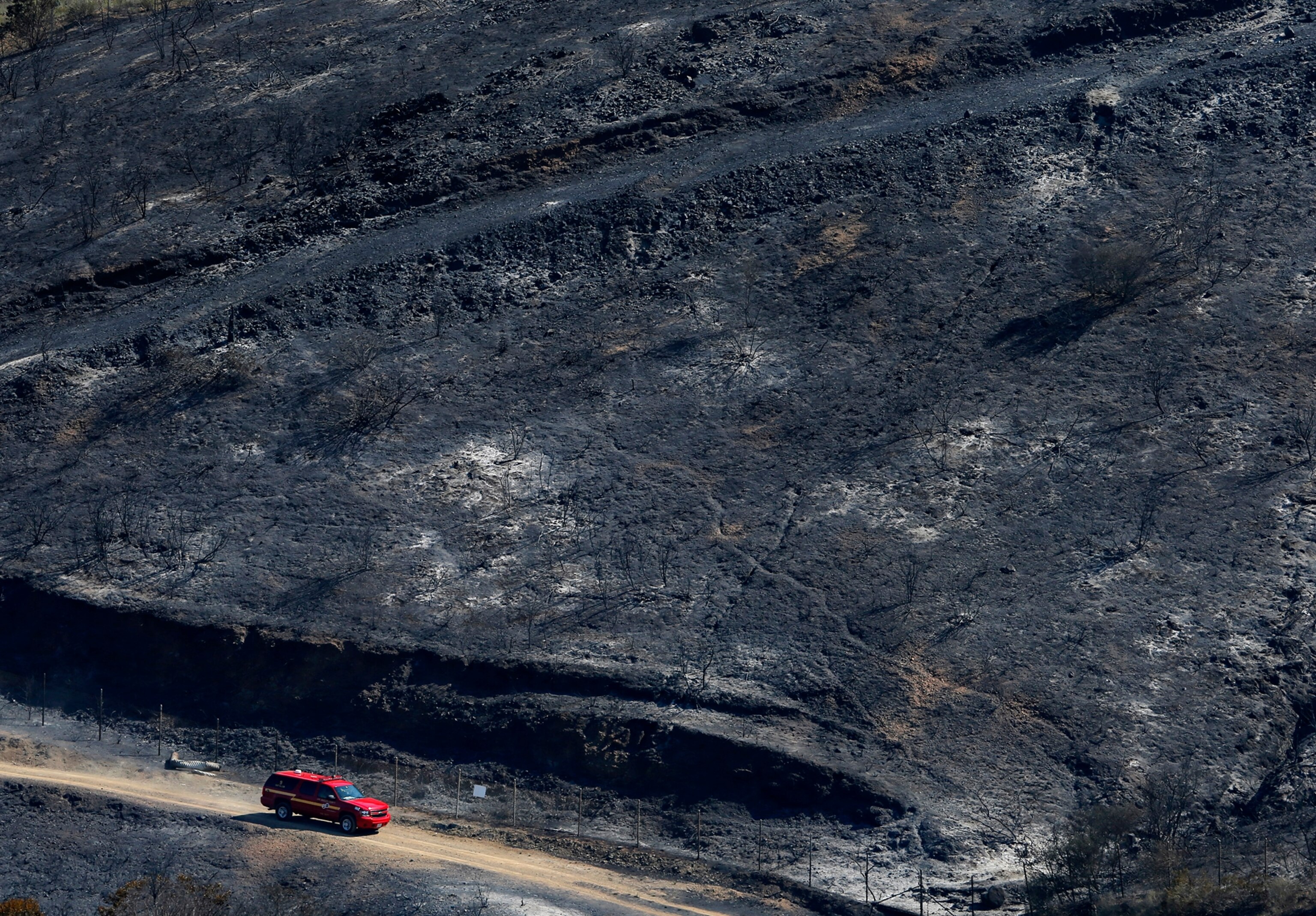 The dry bed of the Stevens Creek Reservoir is seen on Thursday, March 13, 2014, in Cupertino, Calif.