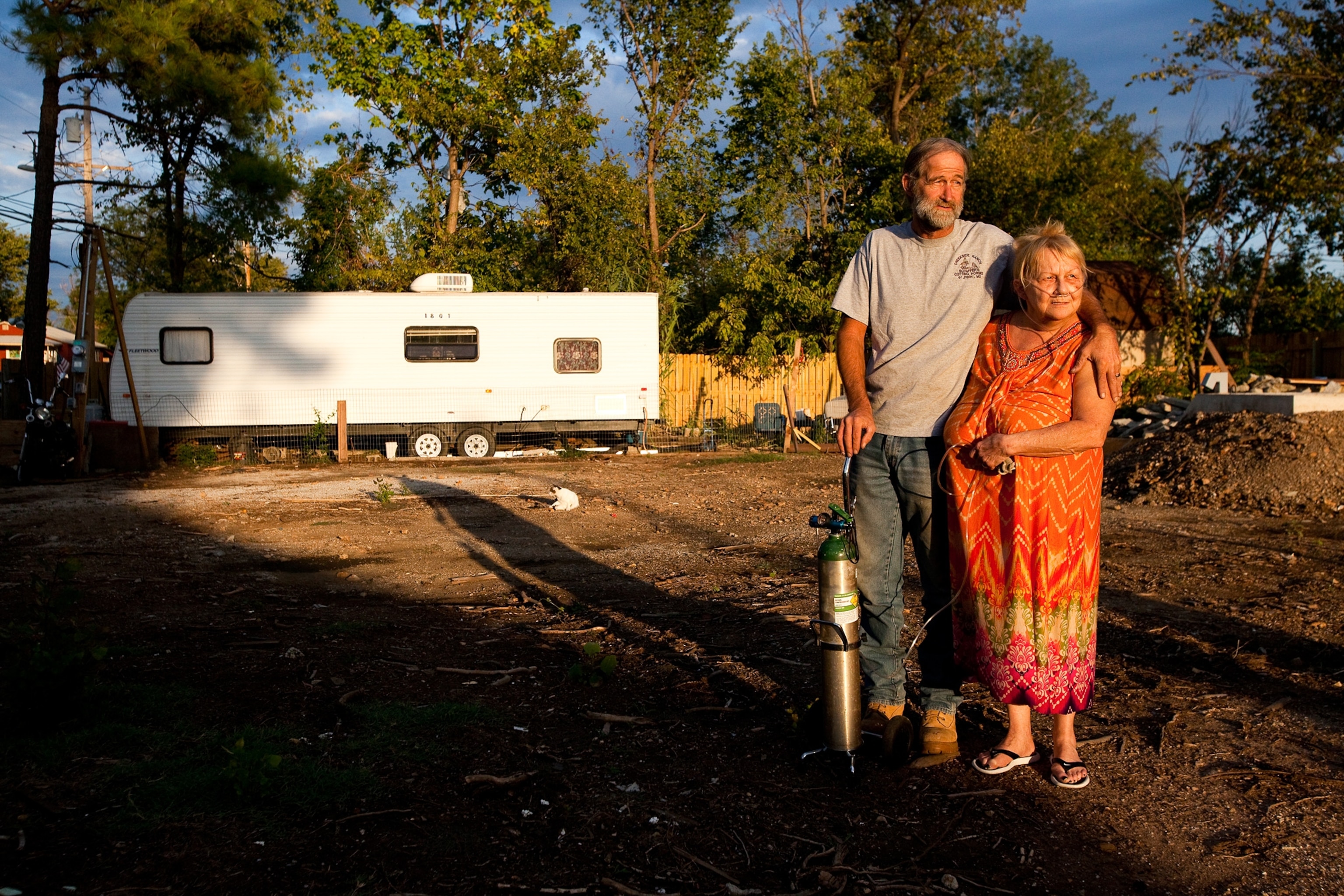 How Joplin Recovered - A couple stands on the land where their house used to be in Joplin, Missouri.