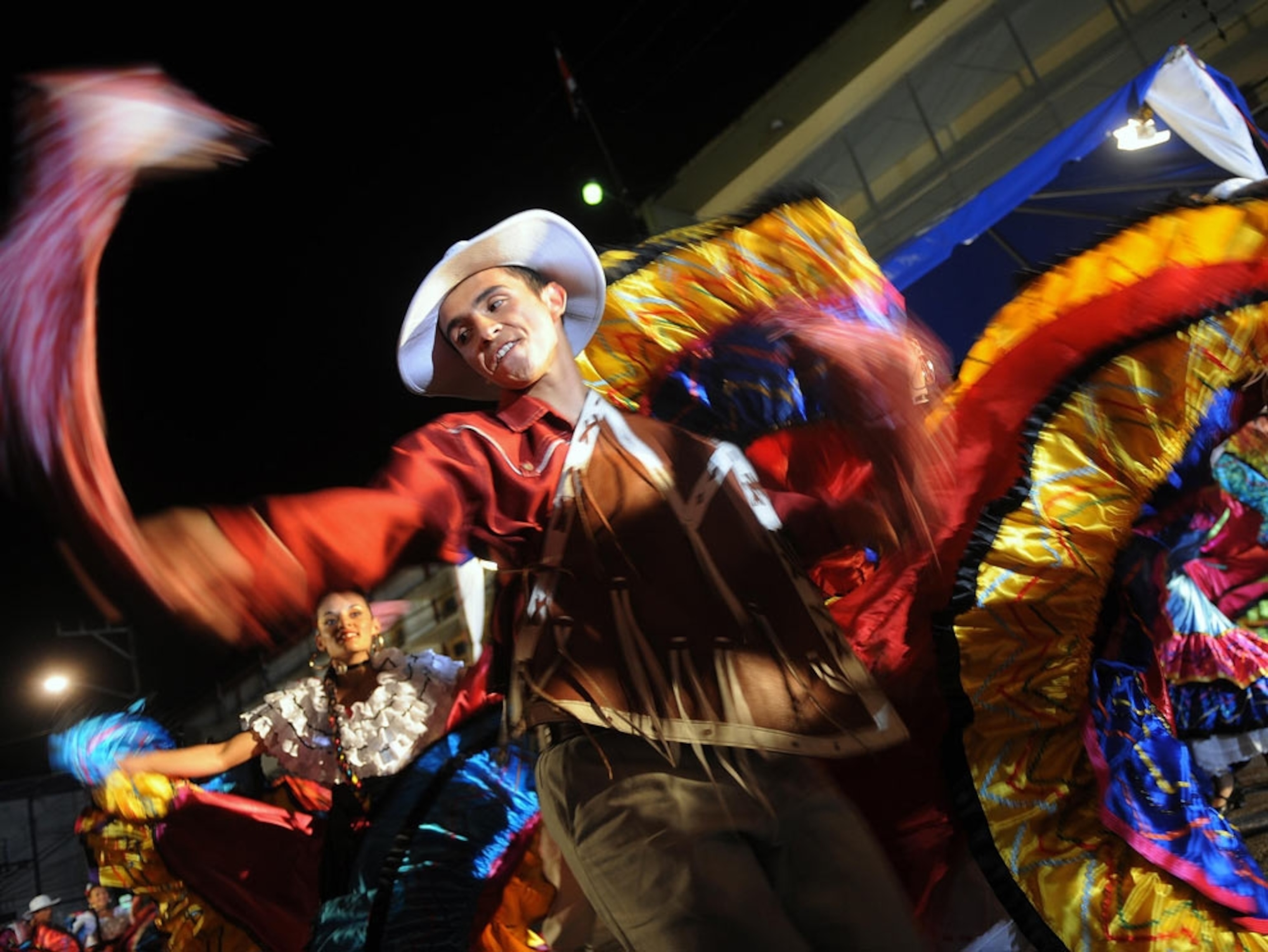 Colorful dancers celebrating at night