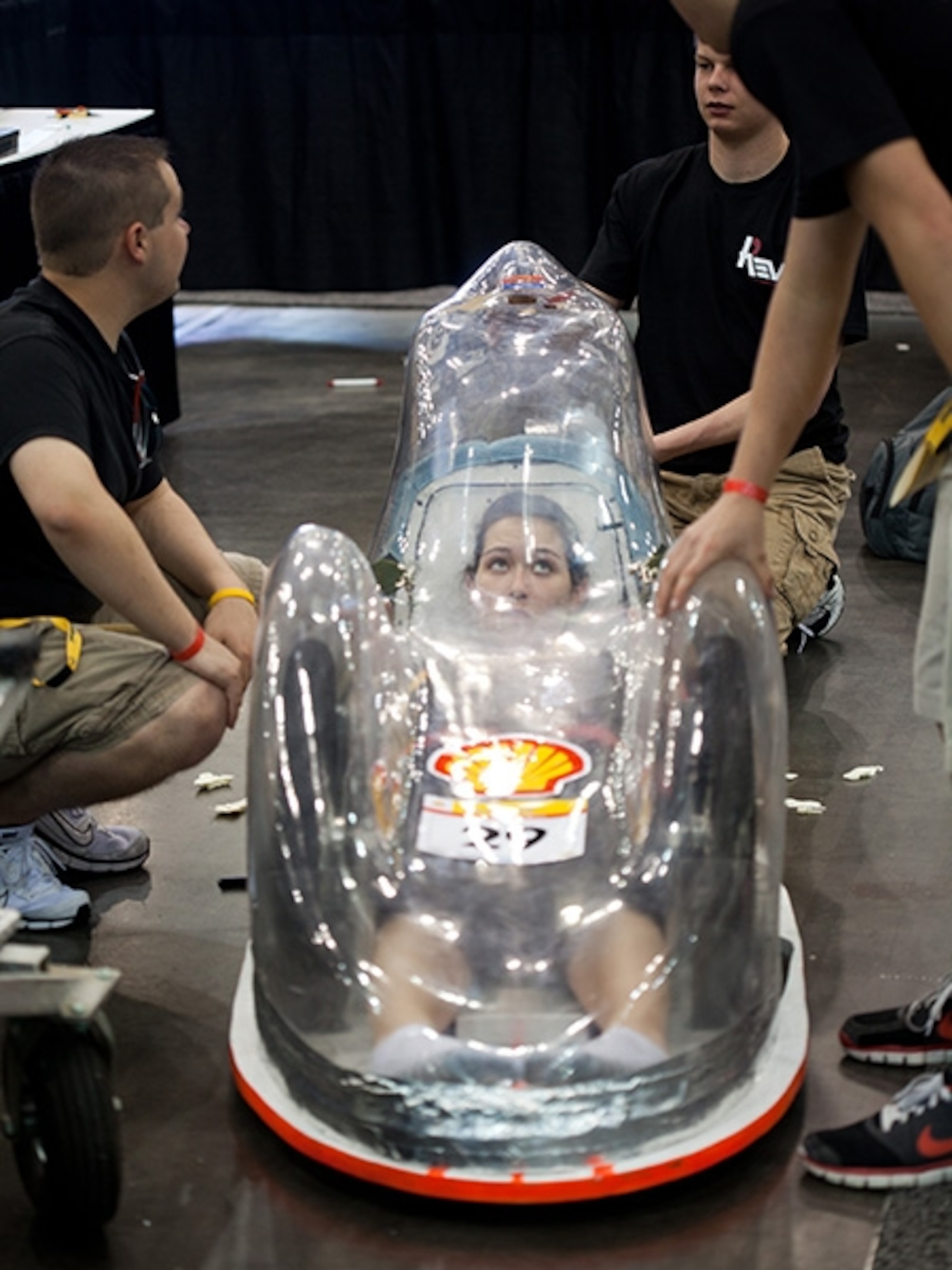 Alexandra Schwier, driver for the Rose-Hulman Institute of Technology gets the feel of the cockpit under the pop bottle plastic shell covering the school's prototype entry in the Eco-marathon.