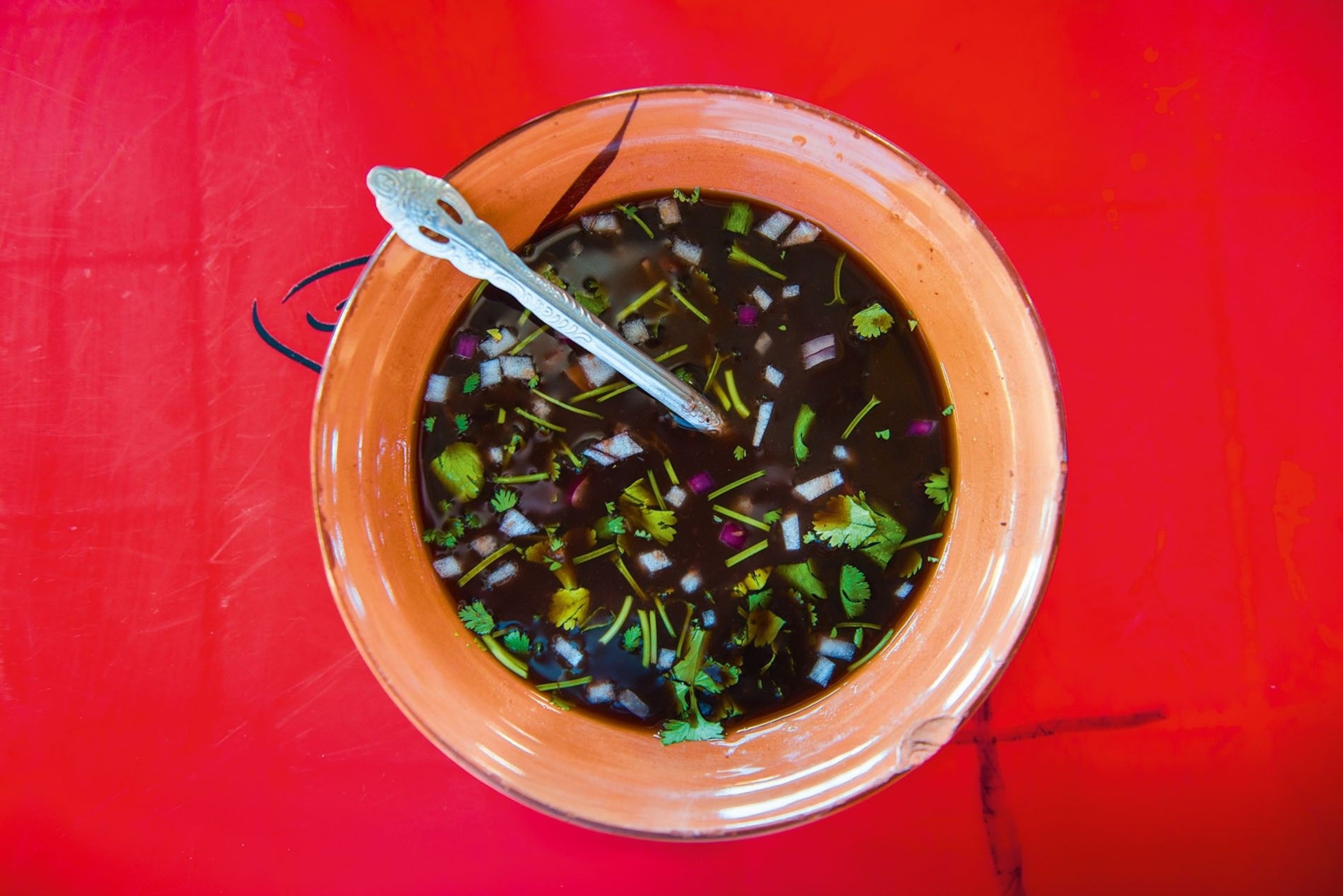 Frijoles topped with coriander