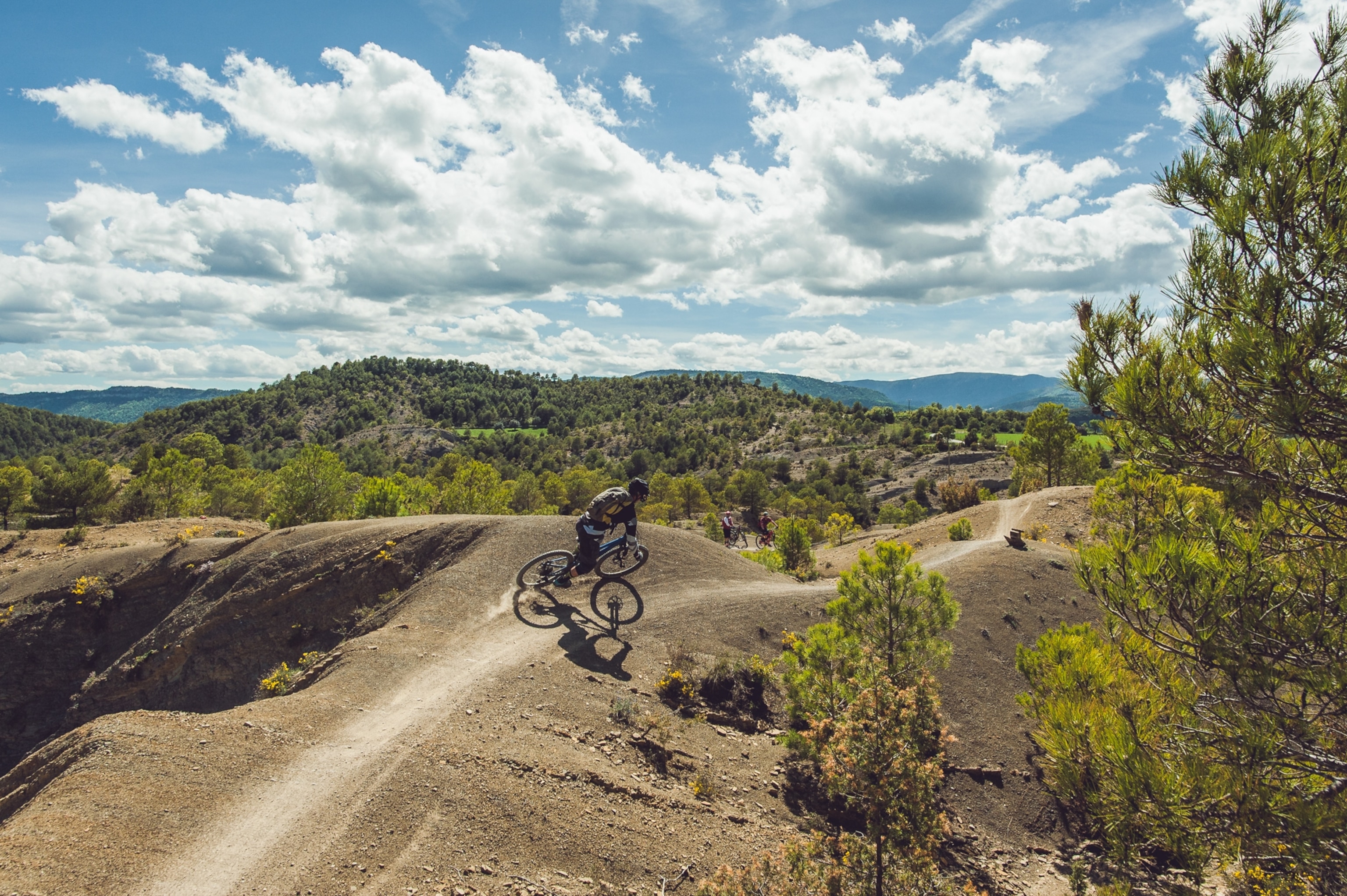 A man rides a bike path.