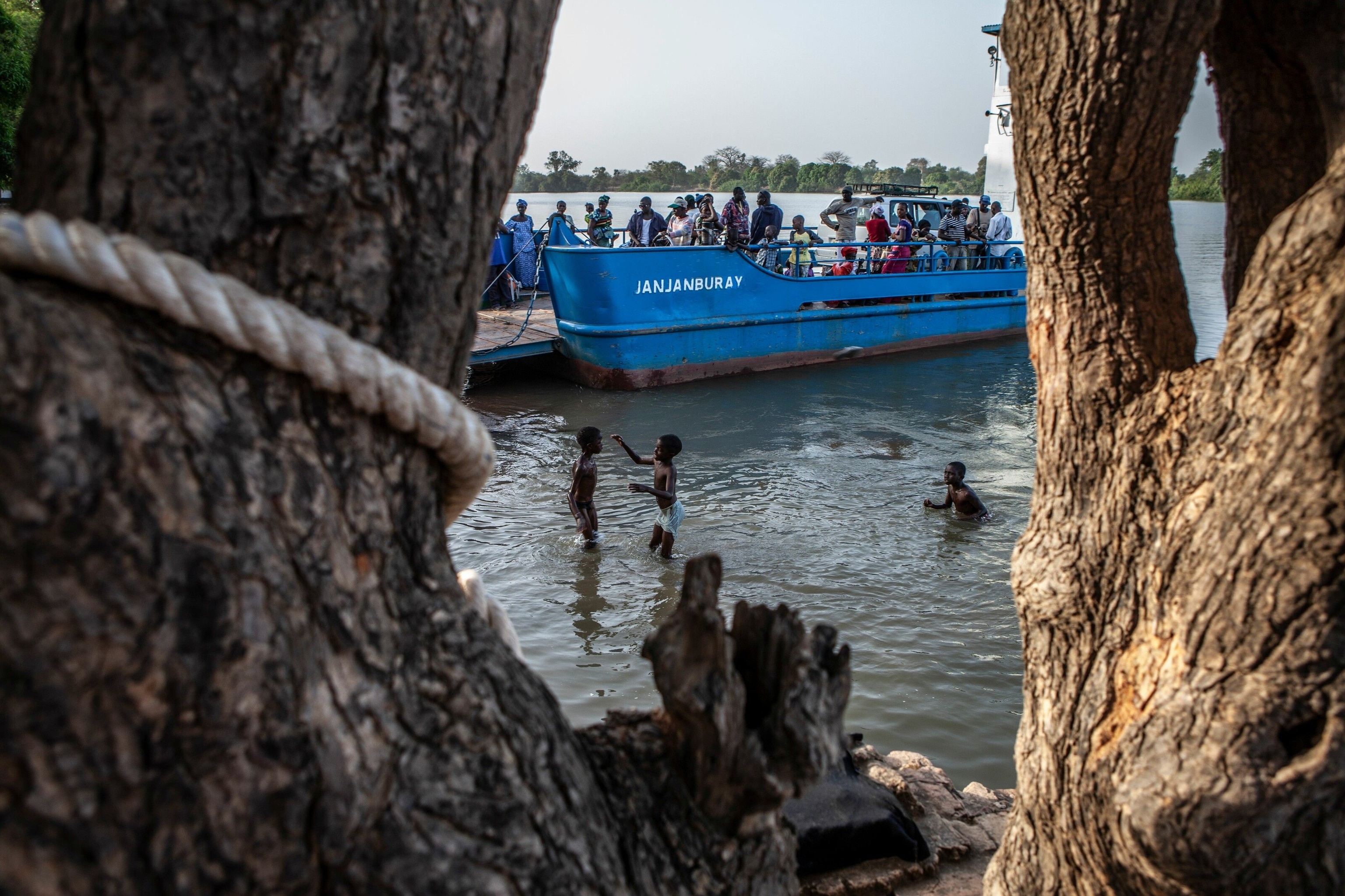Young boys play in the water next to the ferry in Janjanbureh town — known as George Town during the colonial era.
