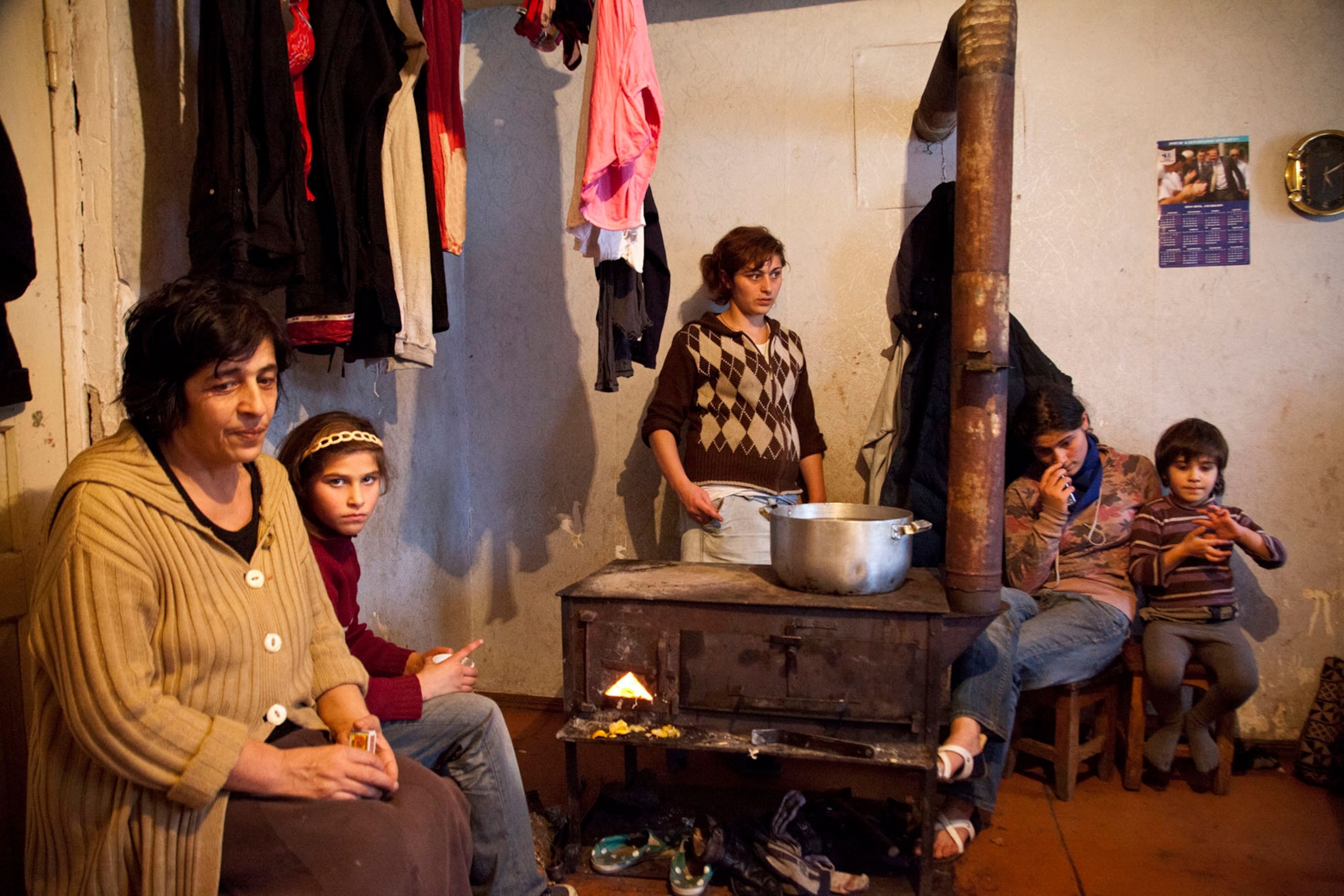 a mineworkers family sitting in their home in Chiatura, Georgia