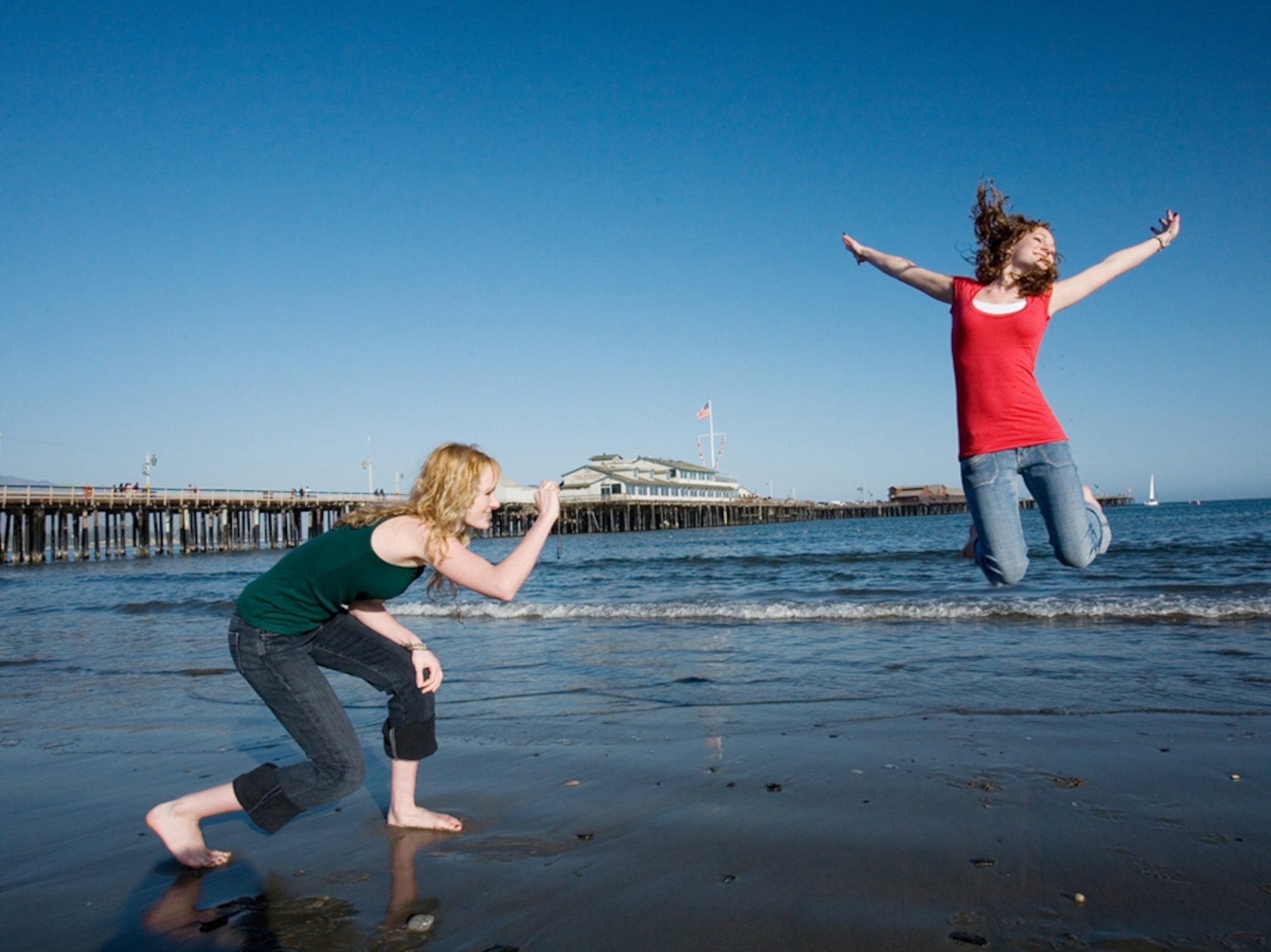 sisters taking pictures on santa barbara beach