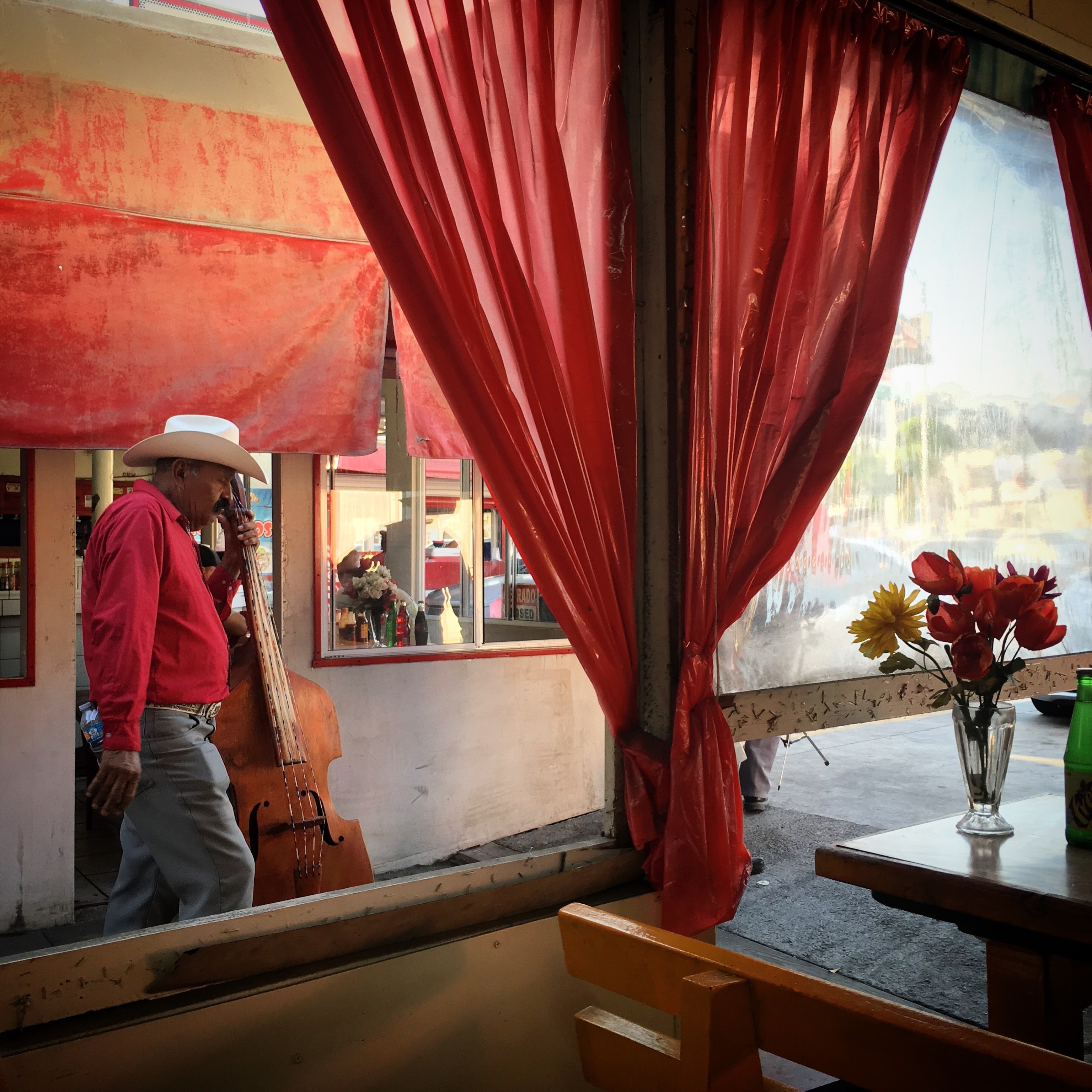a man walking with a bass in Mexico