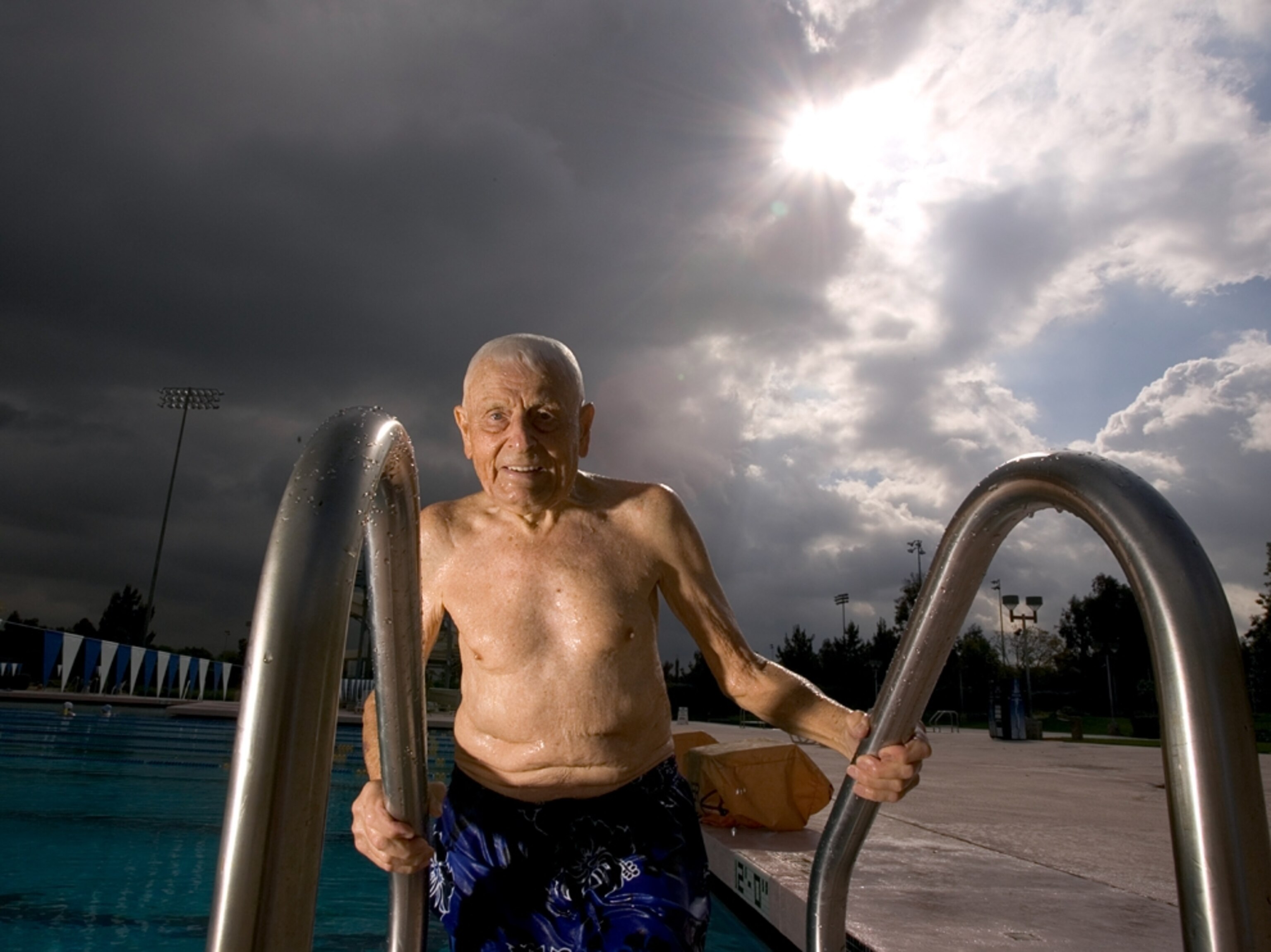 An older man swims during the early morning in Lomo Linda, California