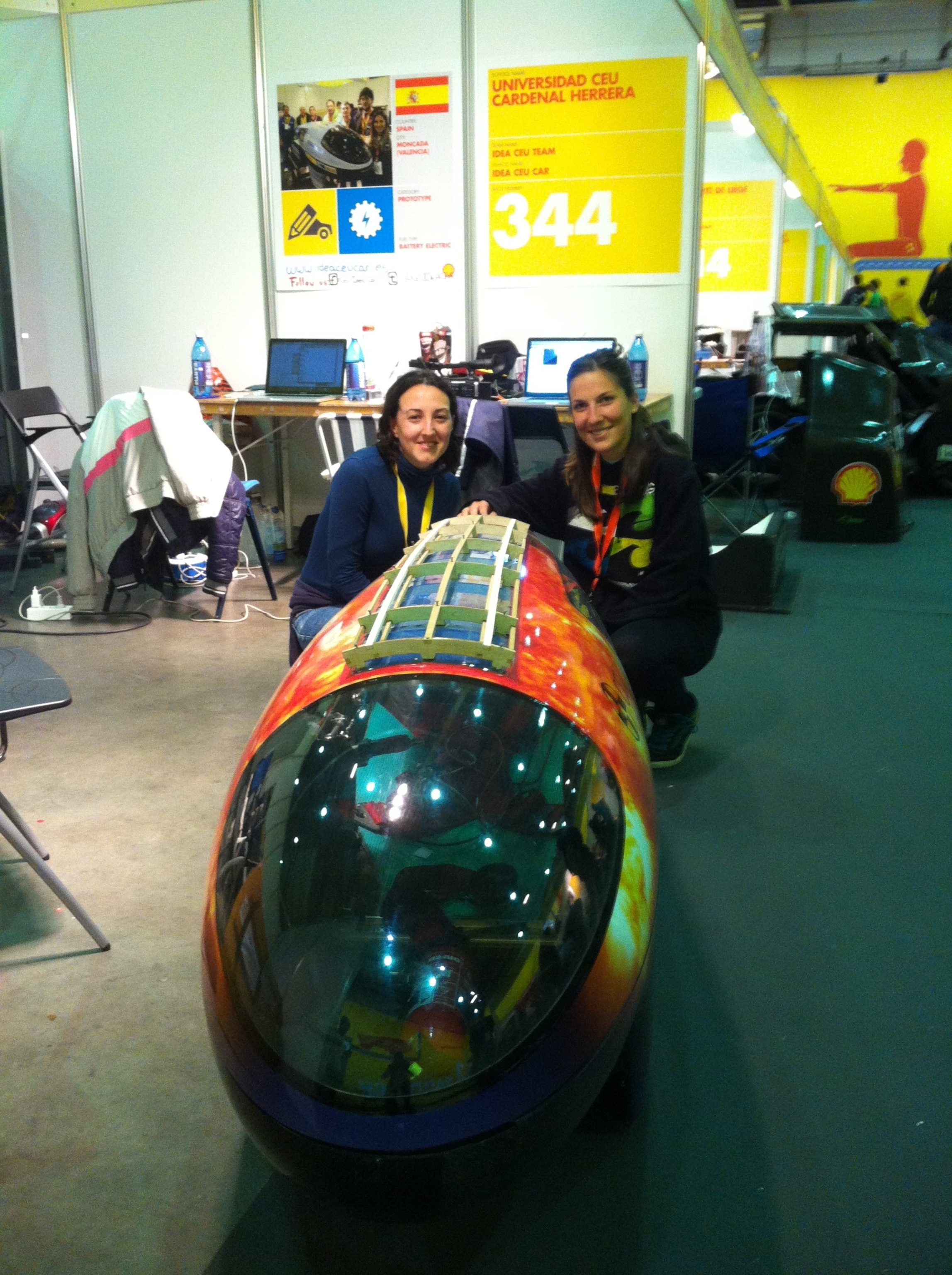 Dana and Lorena with Universidad Ceu Cardenal Herrera's raindrop-shaped vehicle. Photo by Steve Hammond.