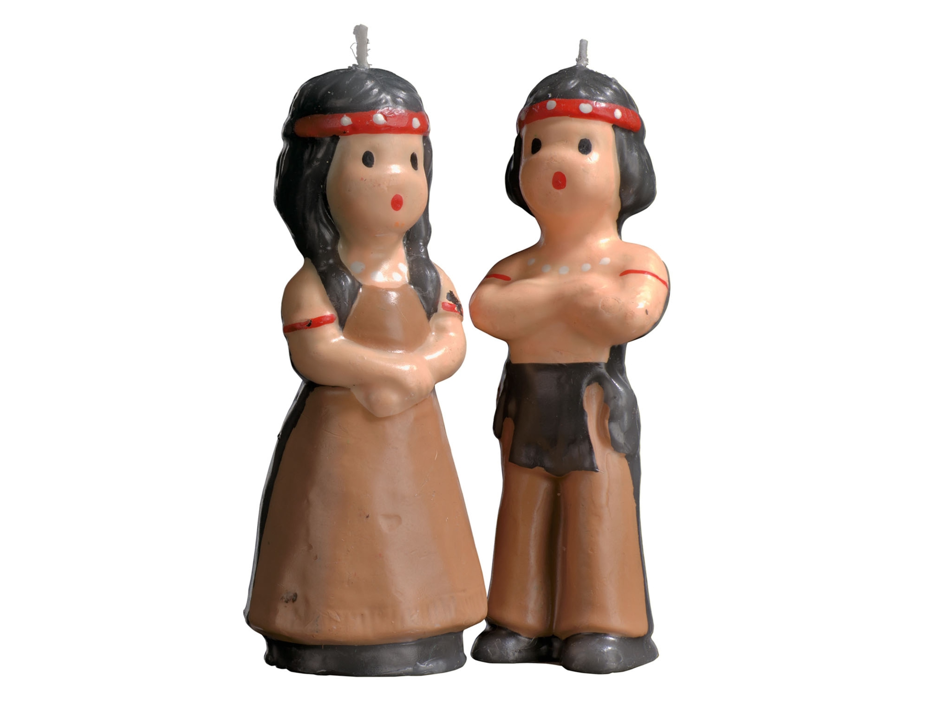 two candles shaped as native american figures