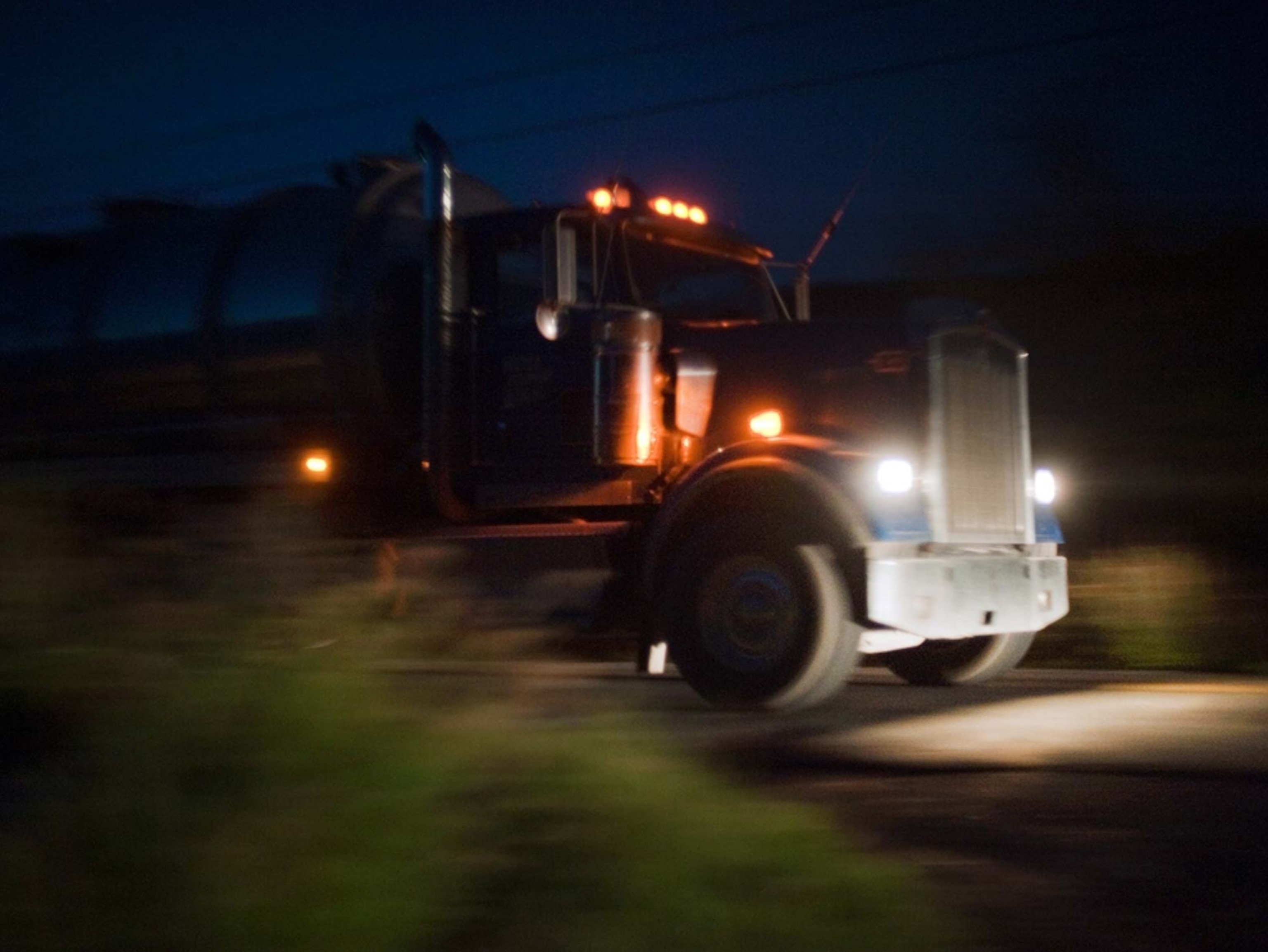 A natural gas industry truck makes its way through the western Pennsylvania night.