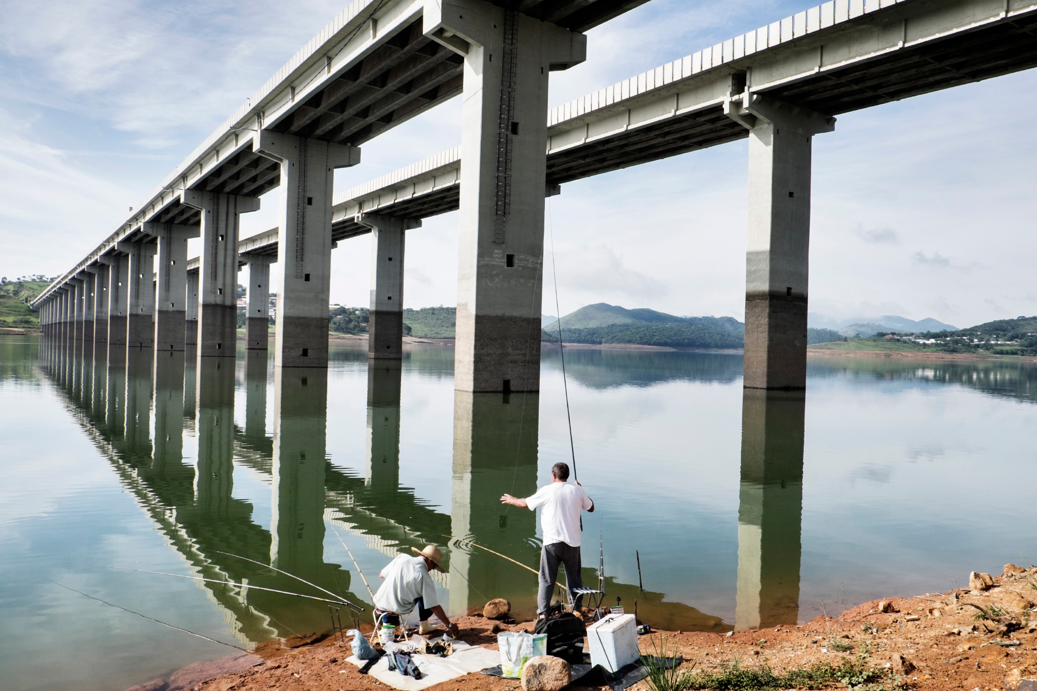 men fishing at pier