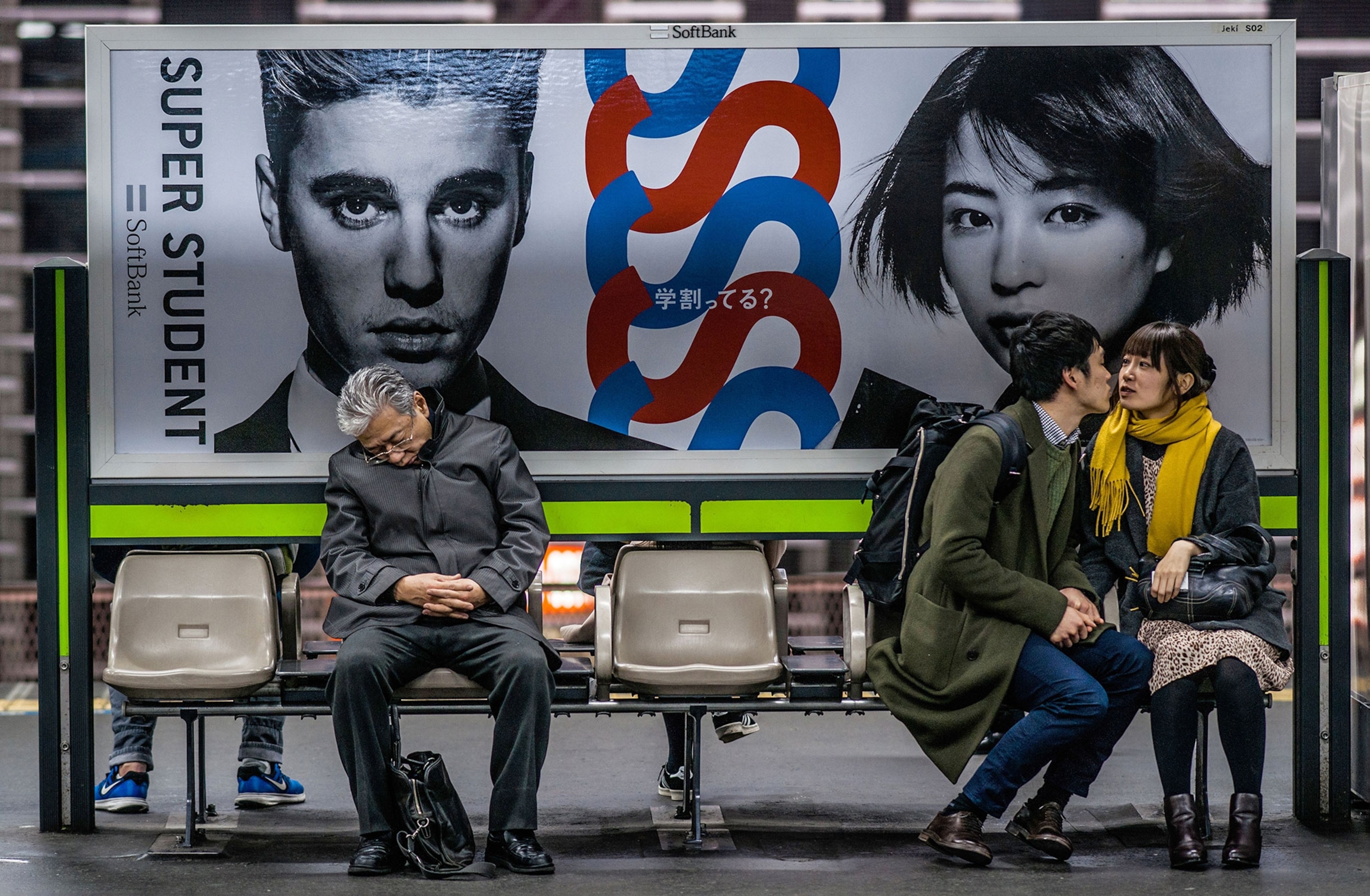 a people waiting at a Tokyo train station