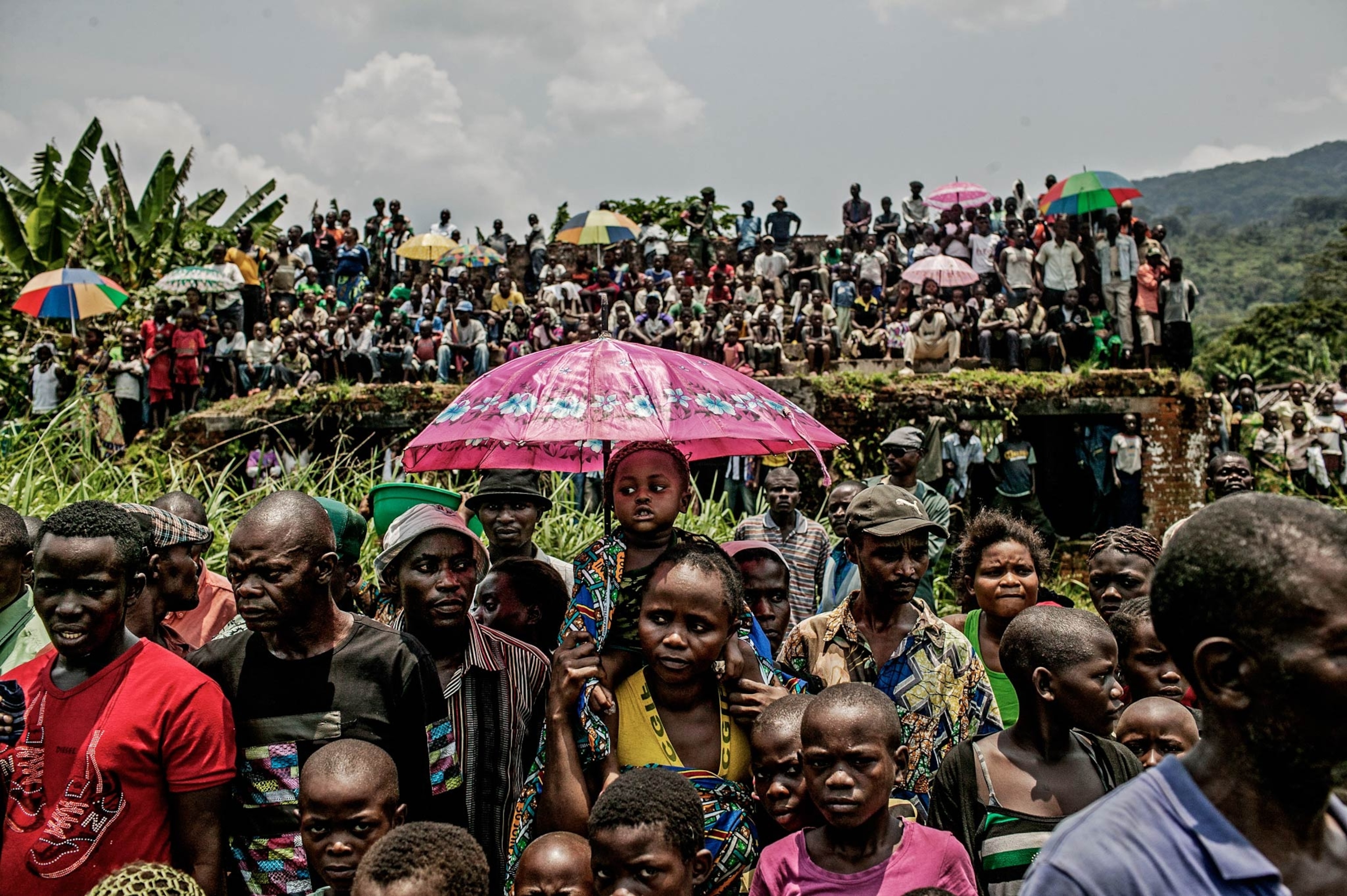 Congolese commandos celebrate as they advance up the mountainous road toward Bunagana, the last remaining stronghold of the M-23 rebels on Wednesday.(Pete Muller for the New York Times)