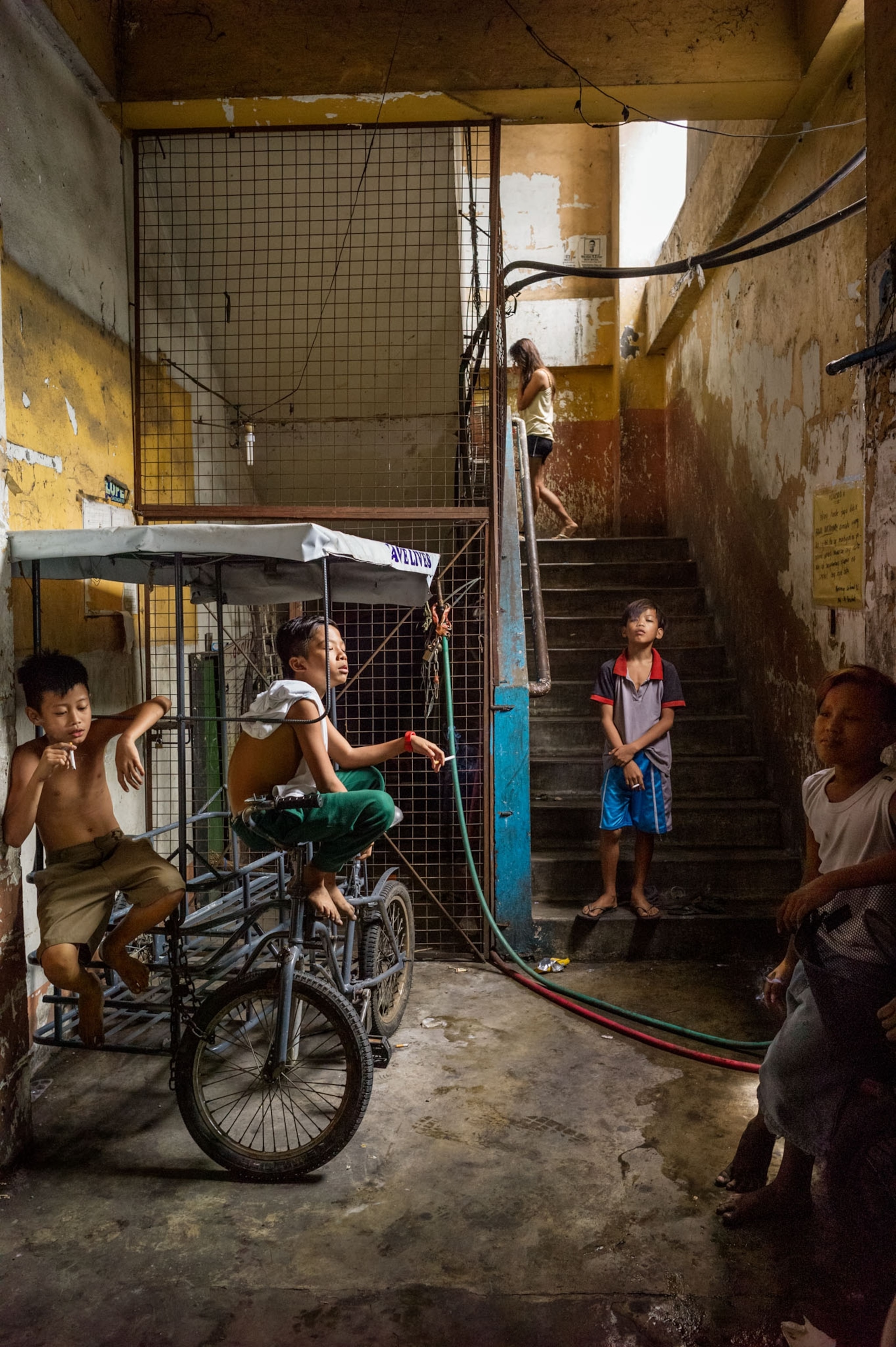 young boys smoking in a hallways