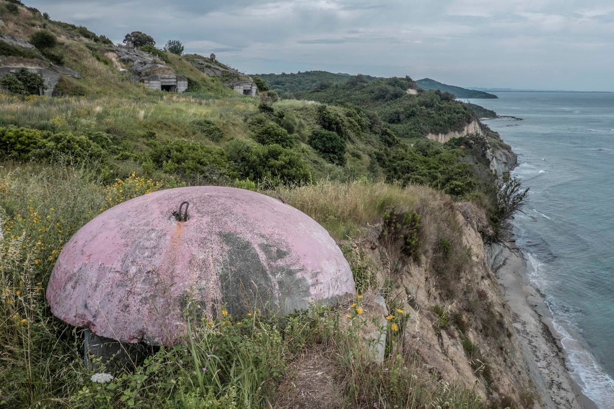 a group of abandoned bunkers near the beach in the peninsula of Cap Rodon