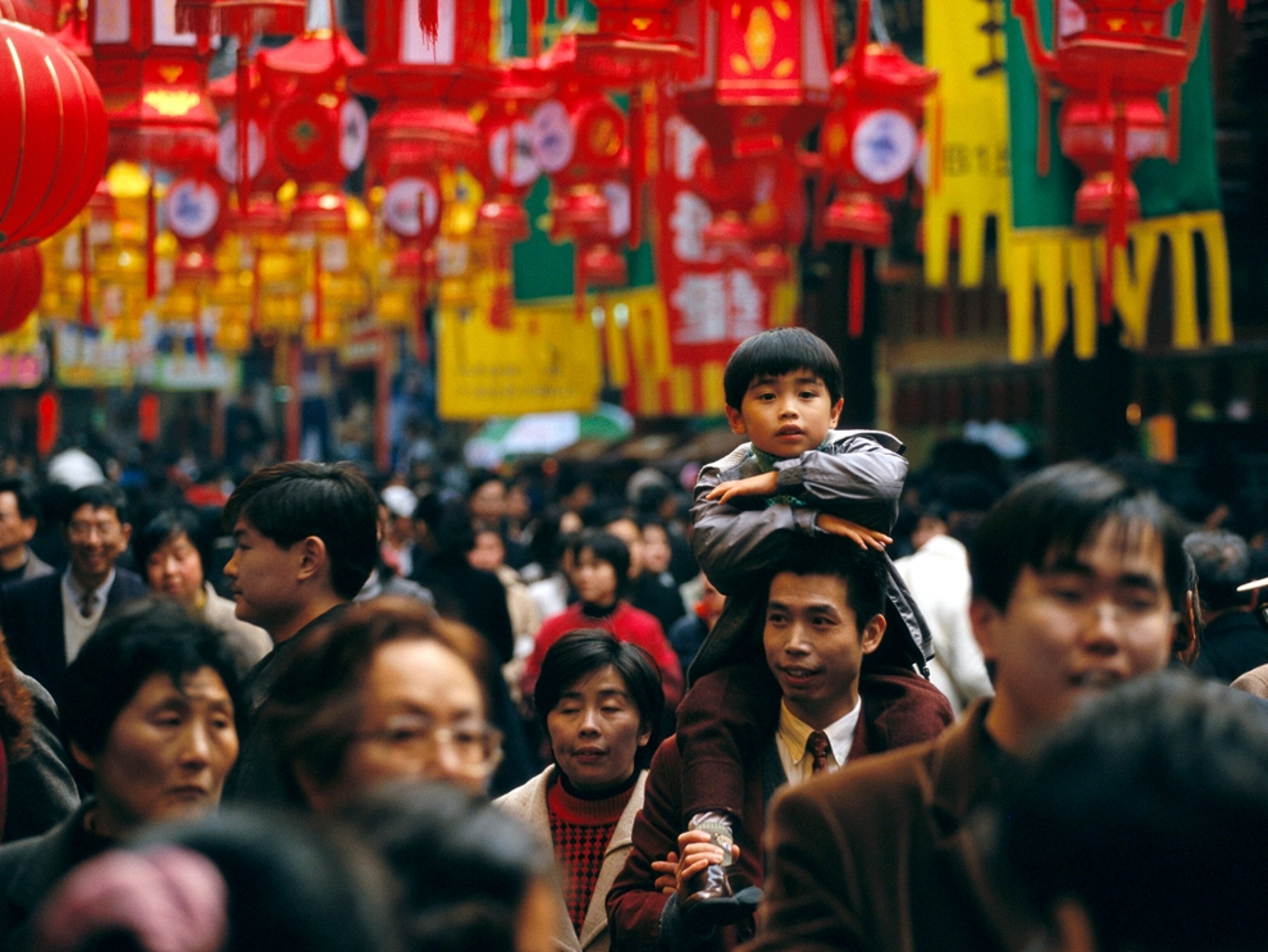 Shanghai street crowded with people and lanterns