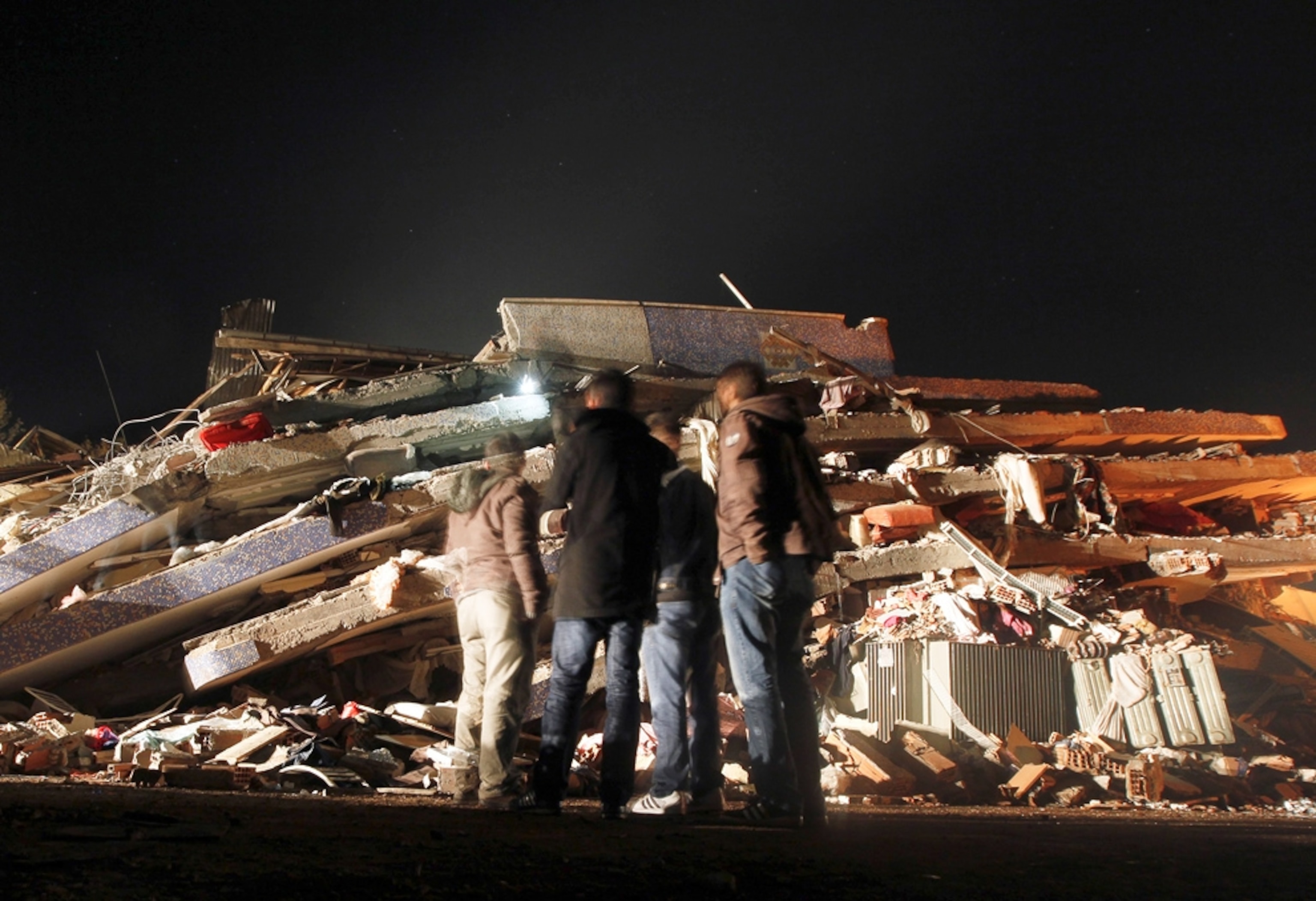 Turkey earthquake picture: Survivors standing in front of rubble