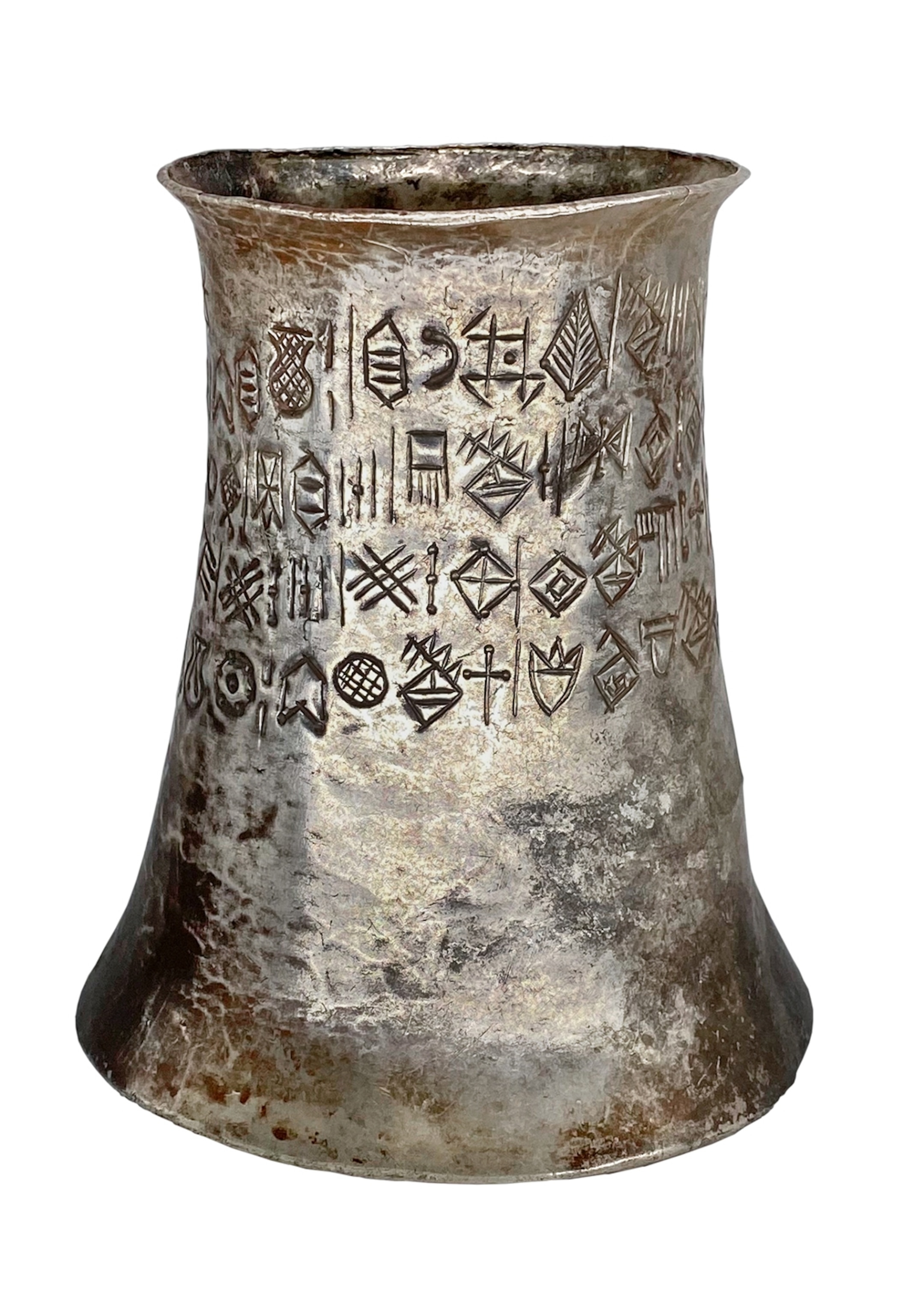 A silver beaker with characters engraved around the sides.