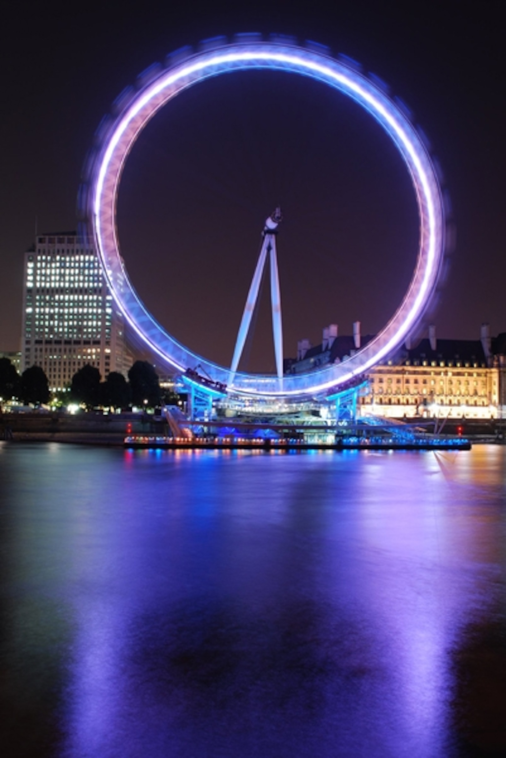 Ferris wheel on the Thames at night in London England