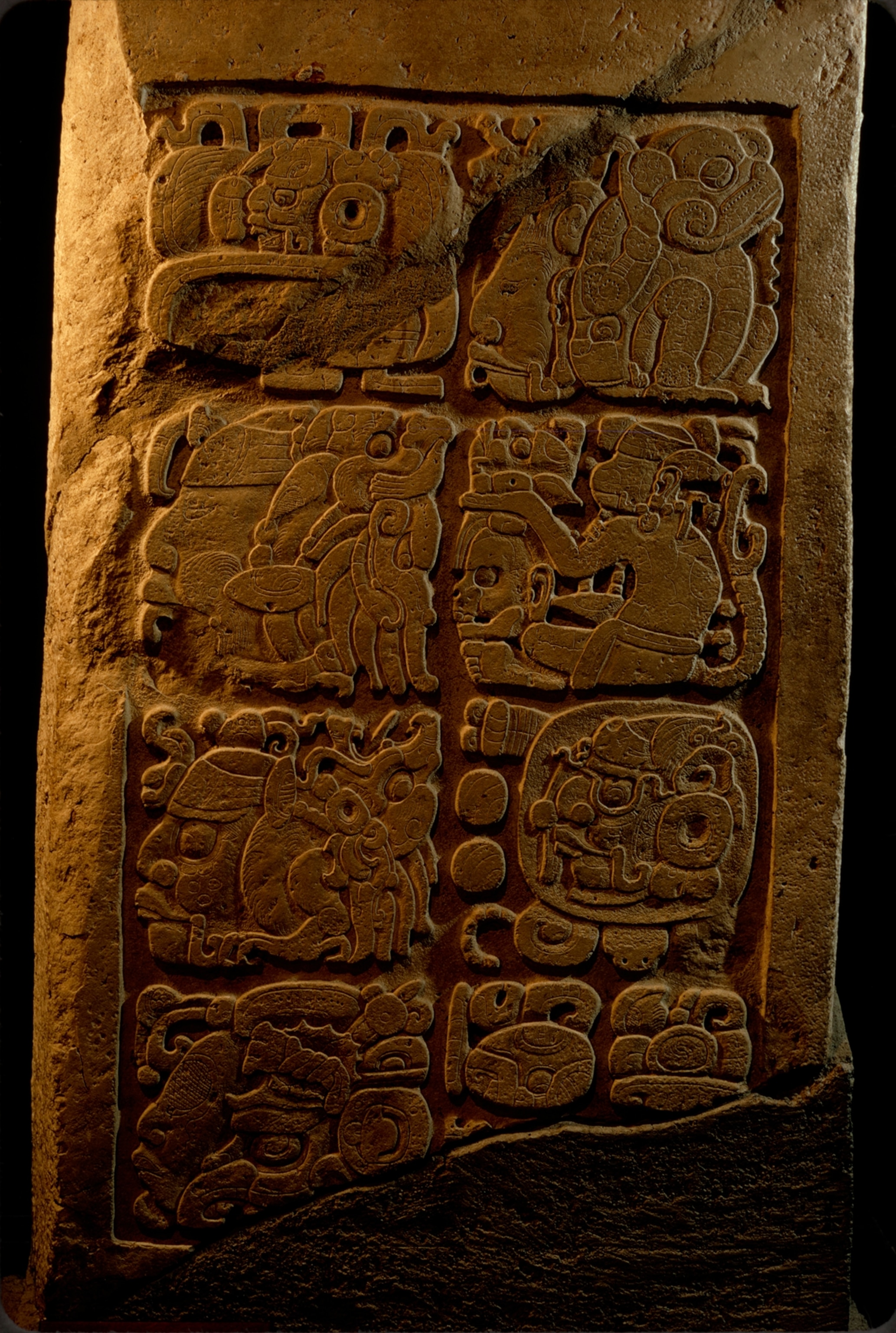 Magnificent obsession of the Maya, time reached its most elaborate expression in glyphs such as these on a limestone lintel from Yaxchilan. Combining head forms and full figures, they portray a single date. Here animals represent blocks of time; the pro files of gods are numbers. The monkey, right, second from top, signals "day"; in his hand a god's head, gazing skyward, means six; the skull below the hand, facing left, is 10. Thus, this glyph stands for 16 days. The sum of the days in all these glyphs is added to a starting point in 3114 B.C. to equal February 11, A.D. 526, in our calendar.