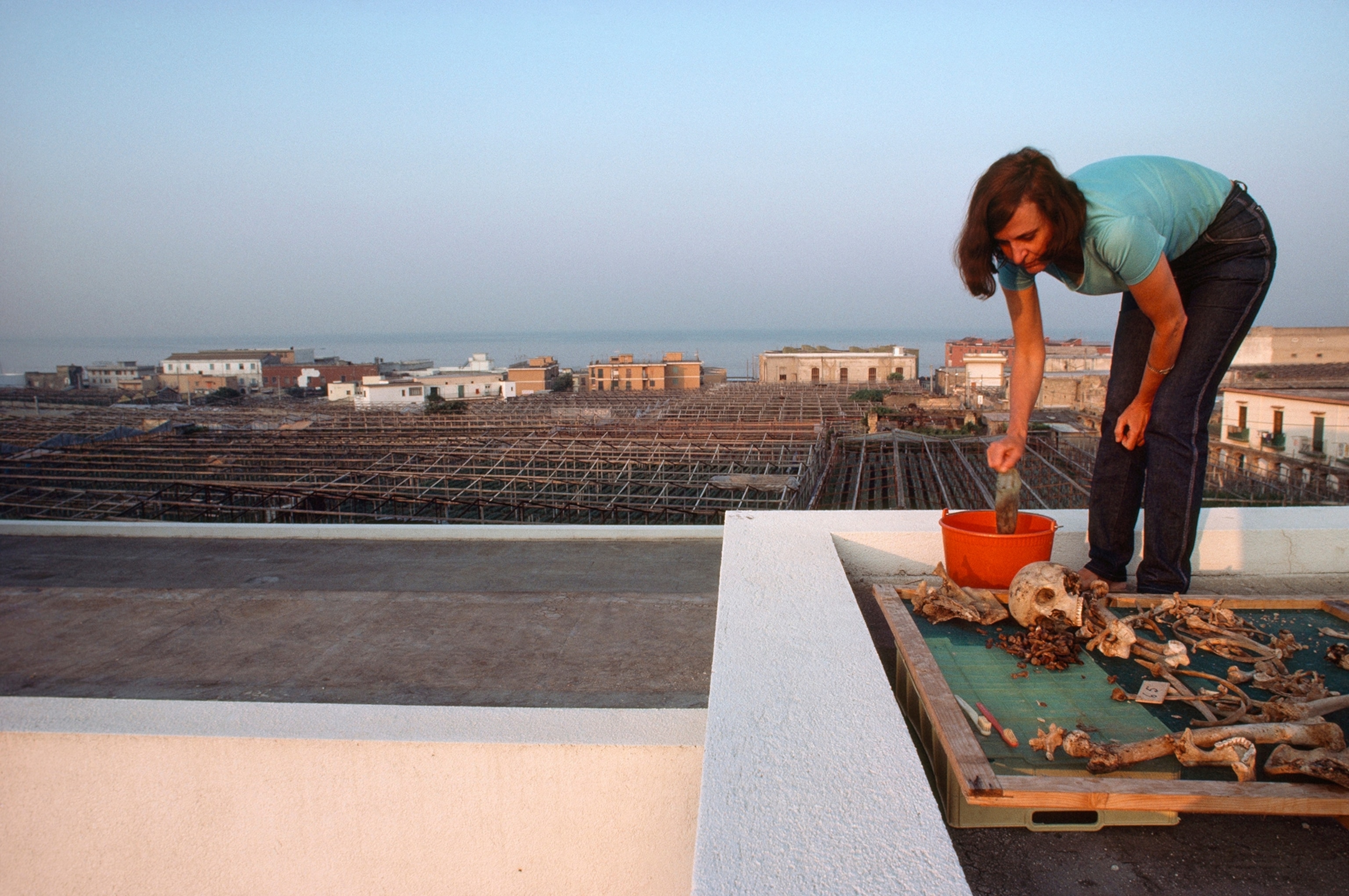 An anthropologist inspects remains found at Herculaneum.