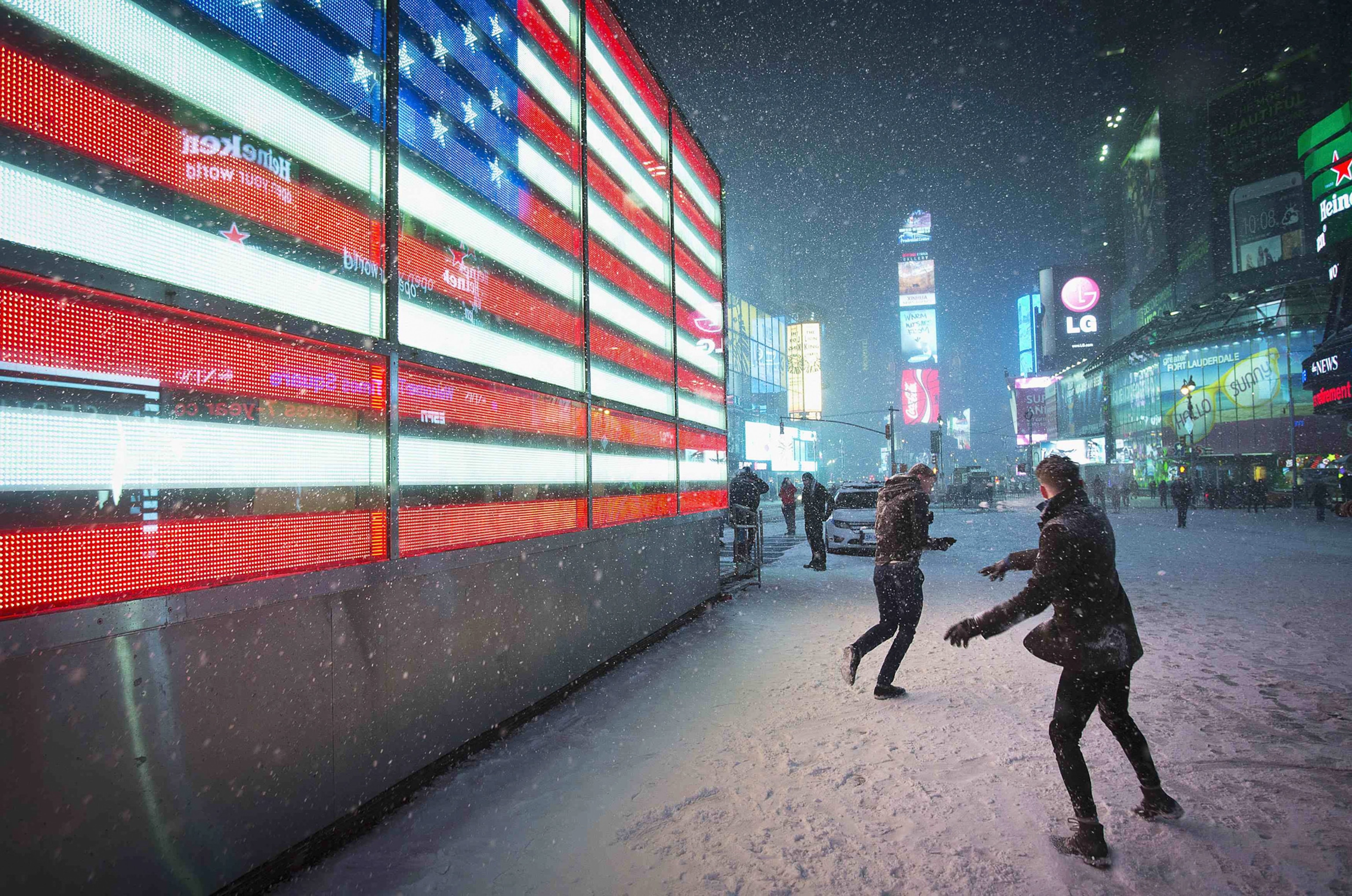 people having a snowball fight in Times Square in New York City