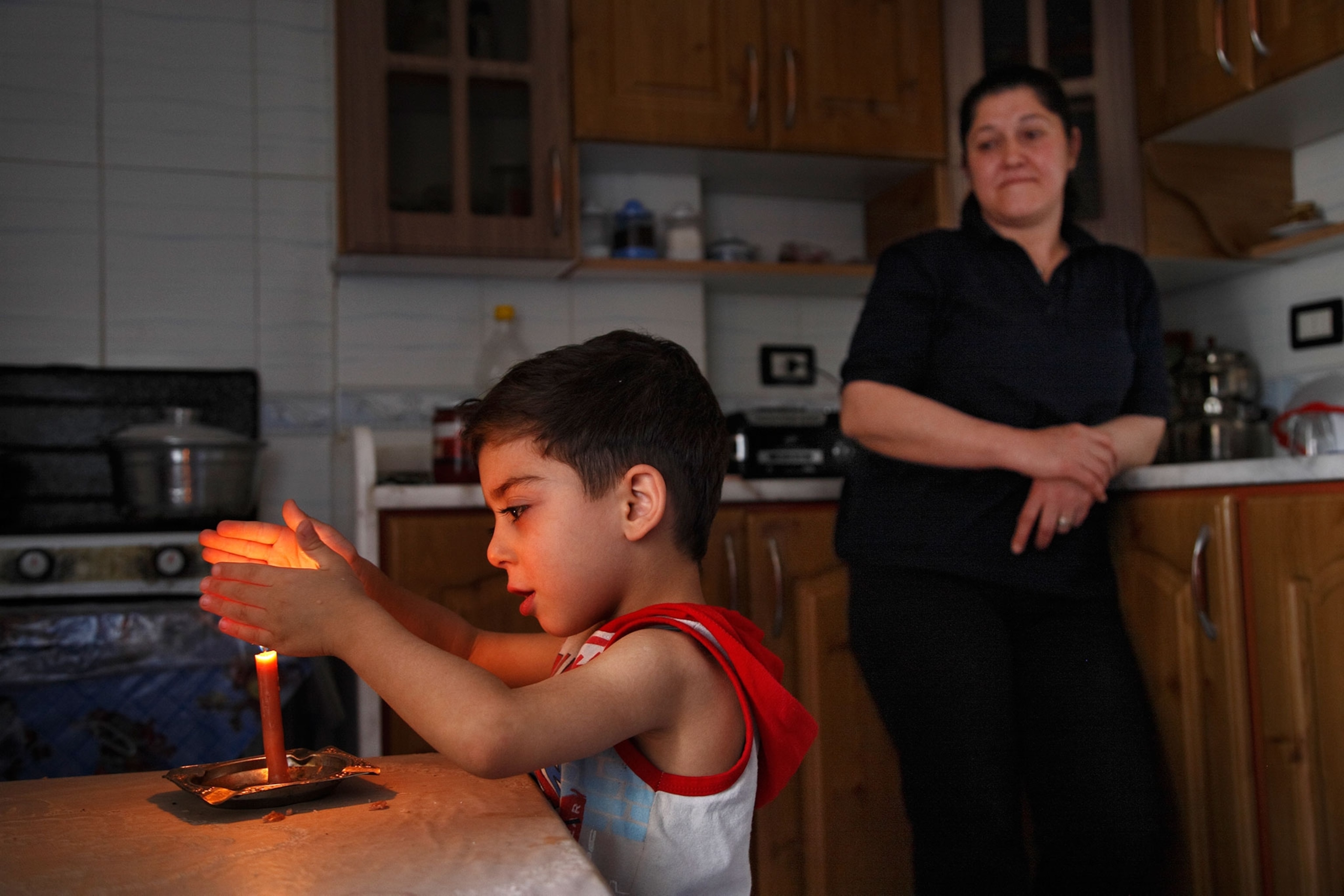boy and mother in kitchen
