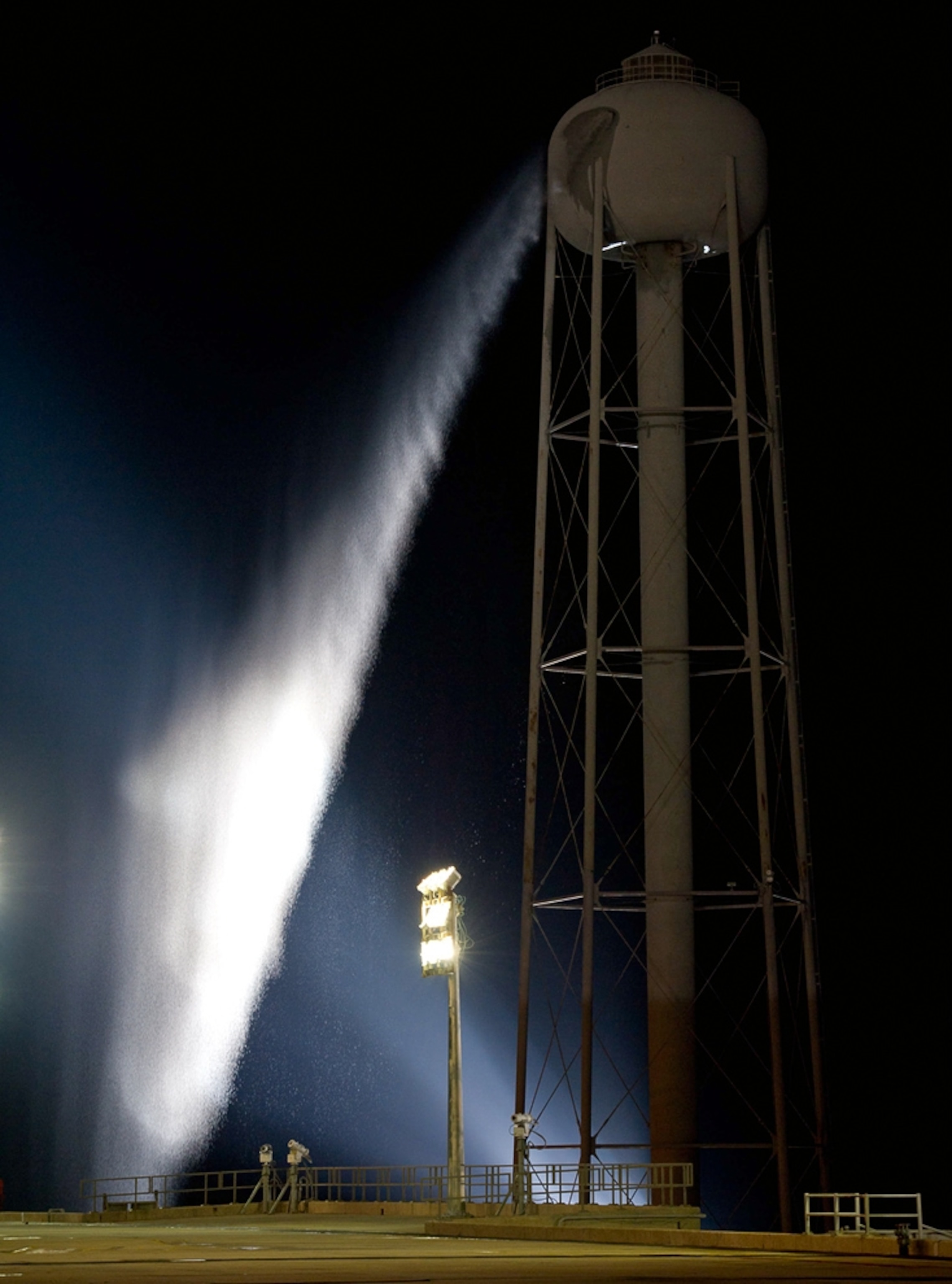 water coming from a sound-suppression tower at a space shuttle launch pad