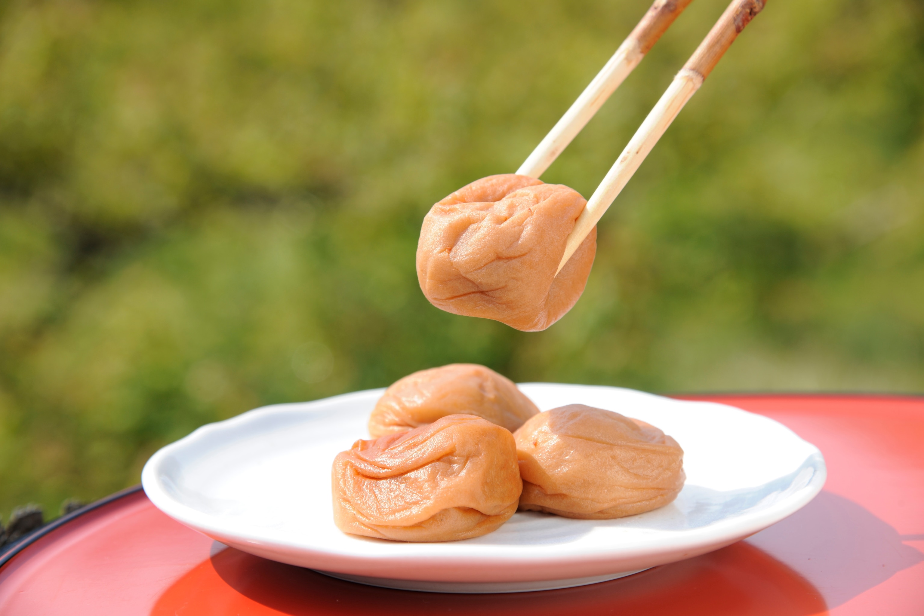Pickled umeboshi served with chopsticks is touted as a hangover cure in Japan. Photograph by JTB Photo/UIG via Getty Images