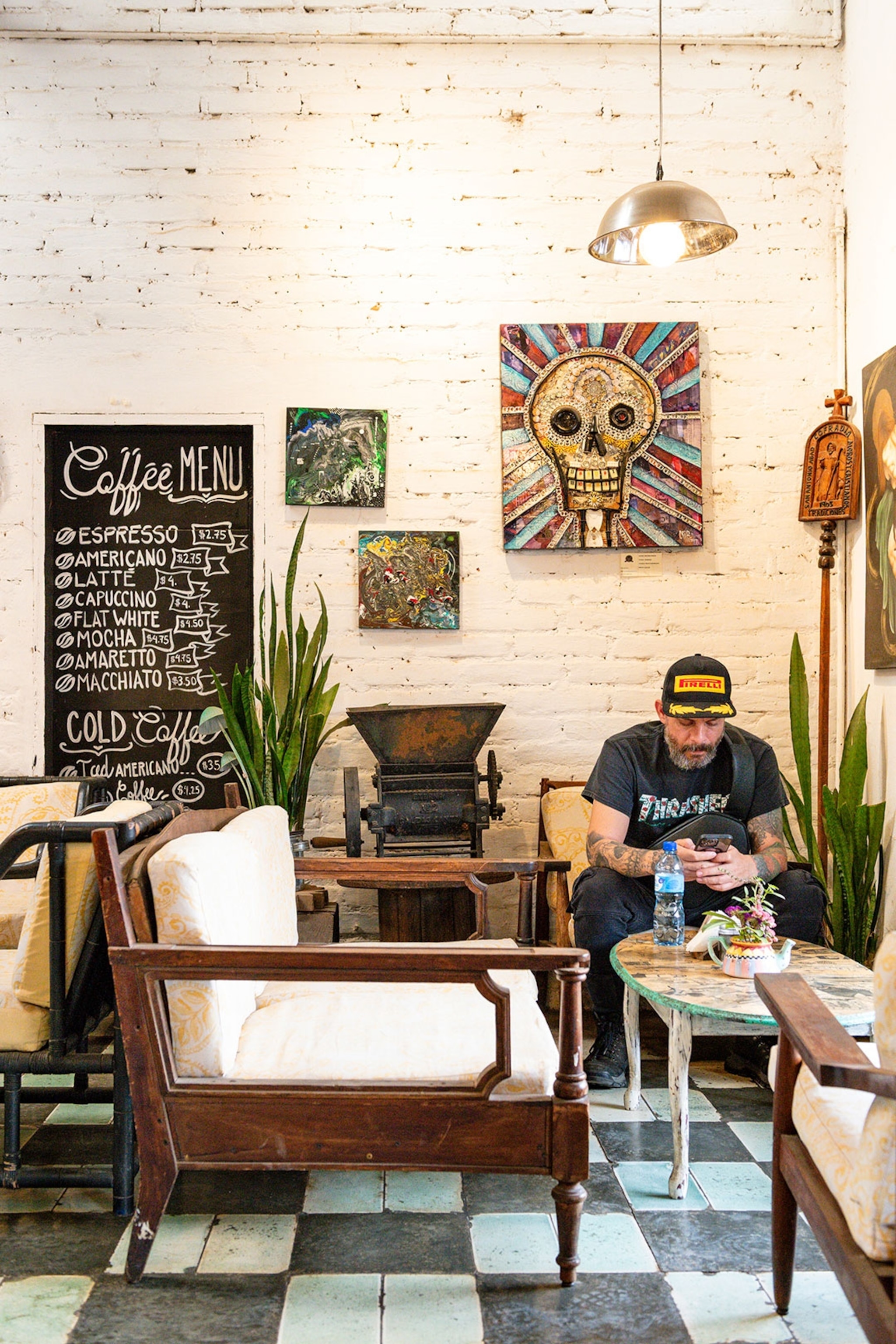A man sitting in a coffee shop in El Salvador.