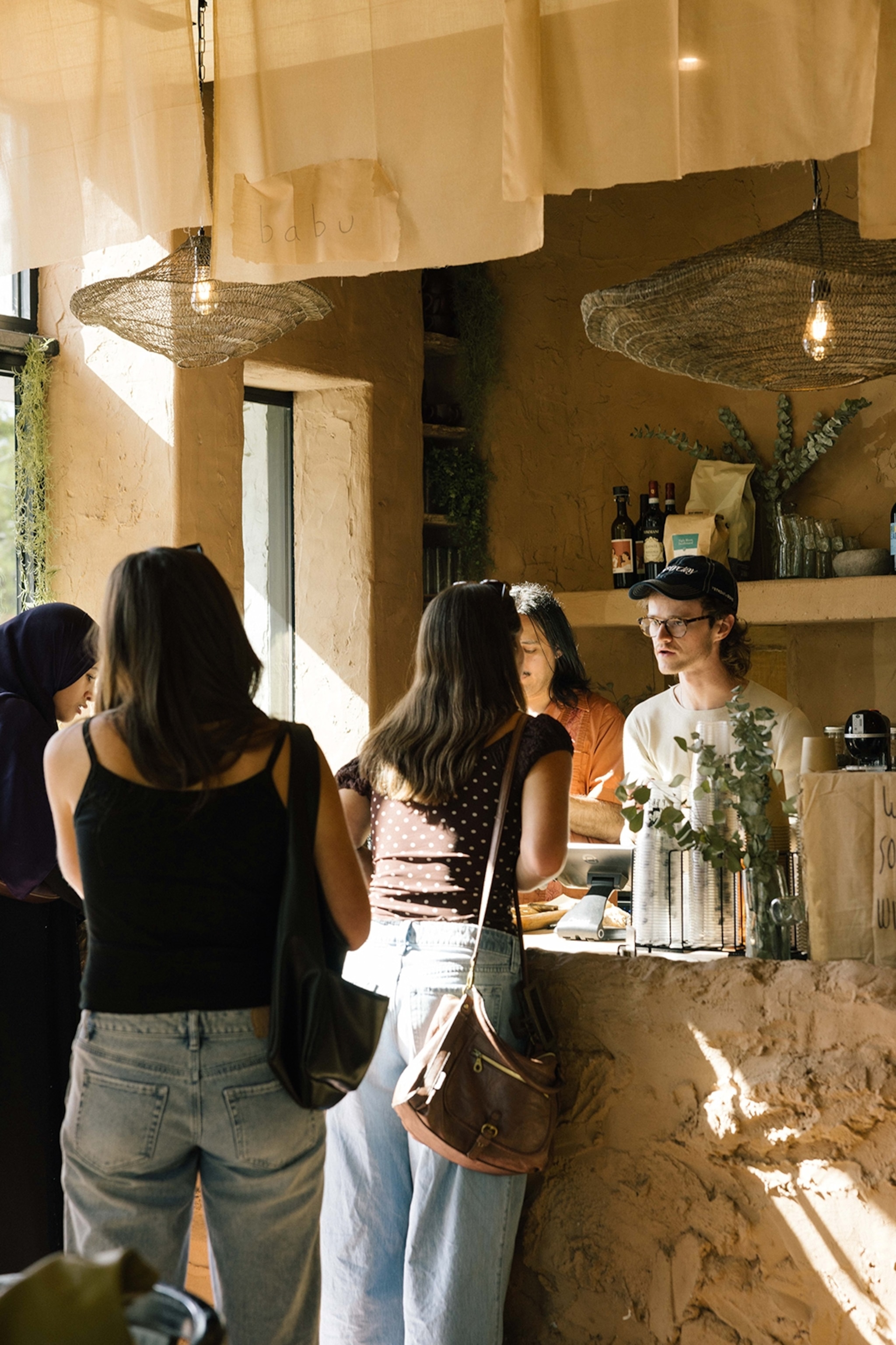 Custimers getting served in a cafe.