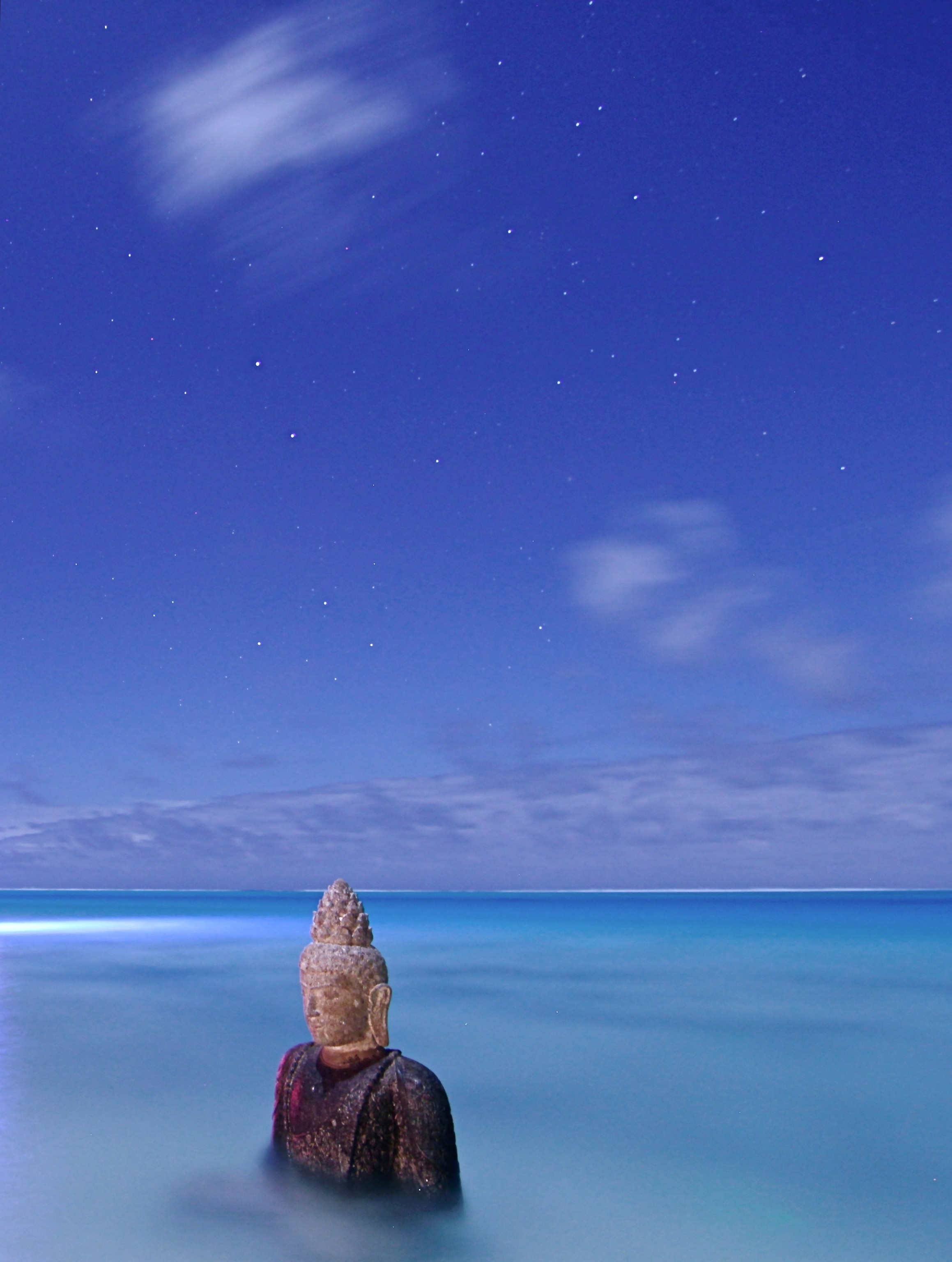 a statue in water in Bora Bora, Indonesia