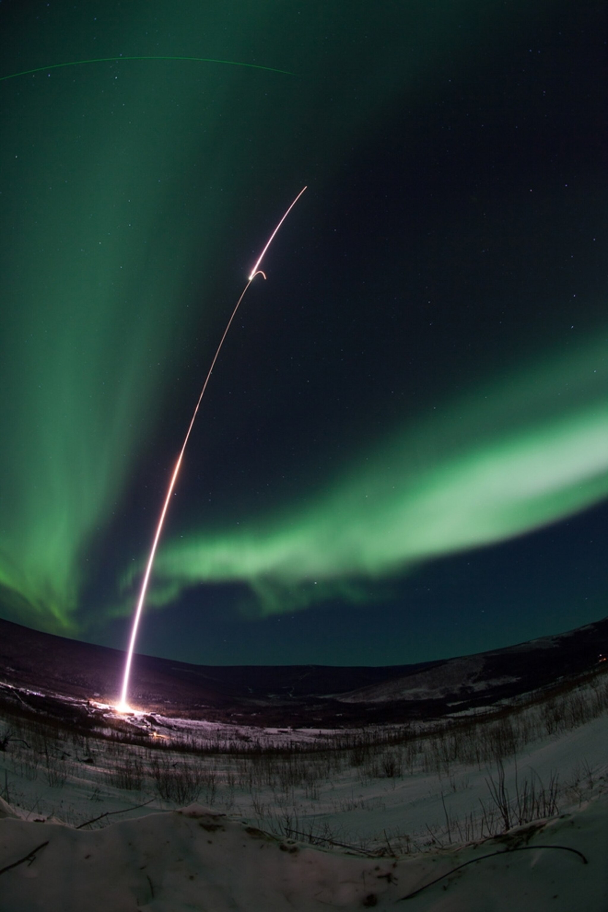 Aurora picture: a rocket launches into auroras in Alaska