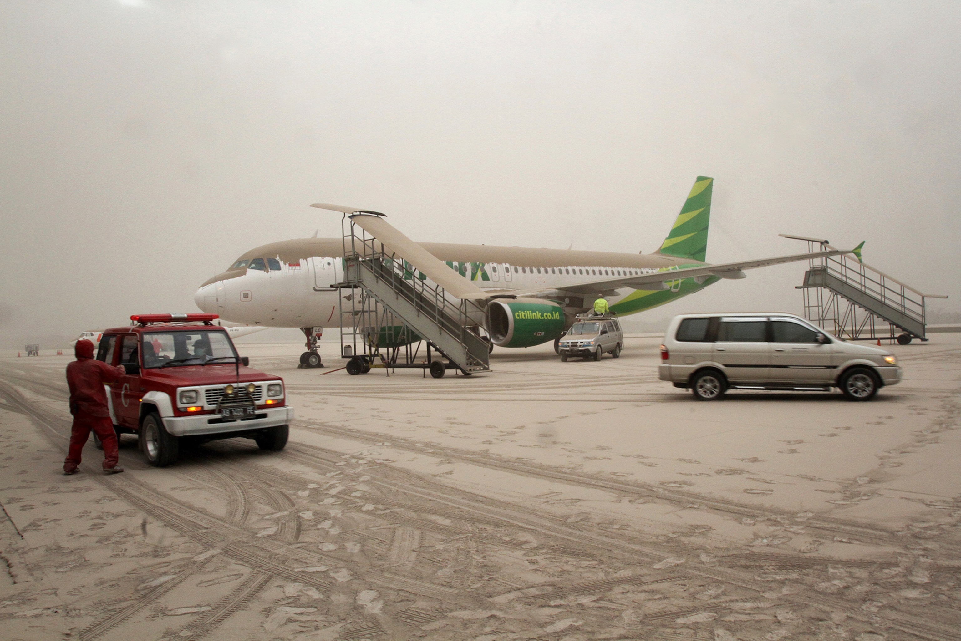 a housing complex covered in ash.