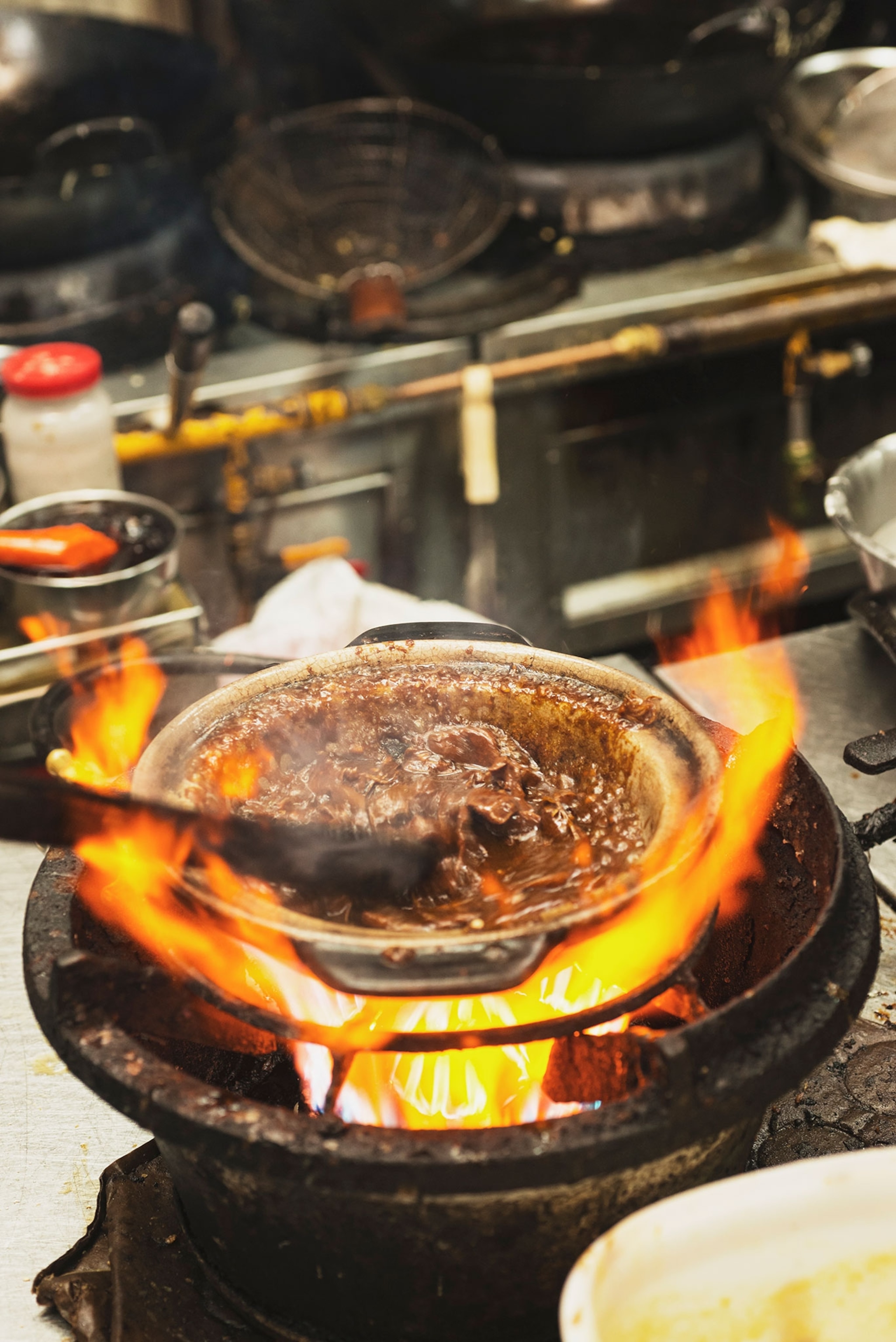 A hot pan with fire rising from the pan.