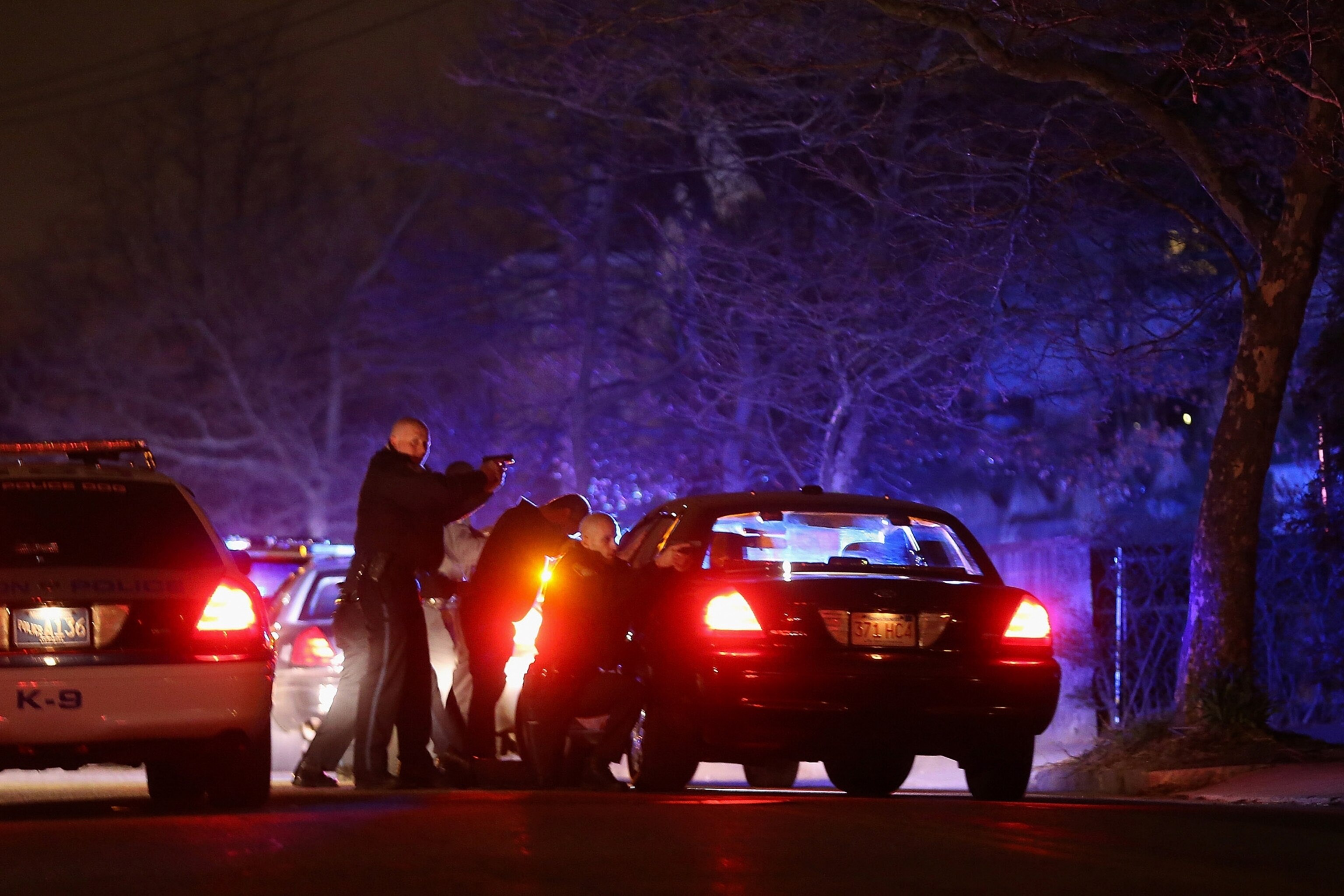 This Week in Boston - Police draw their weapons alongside their squad cars