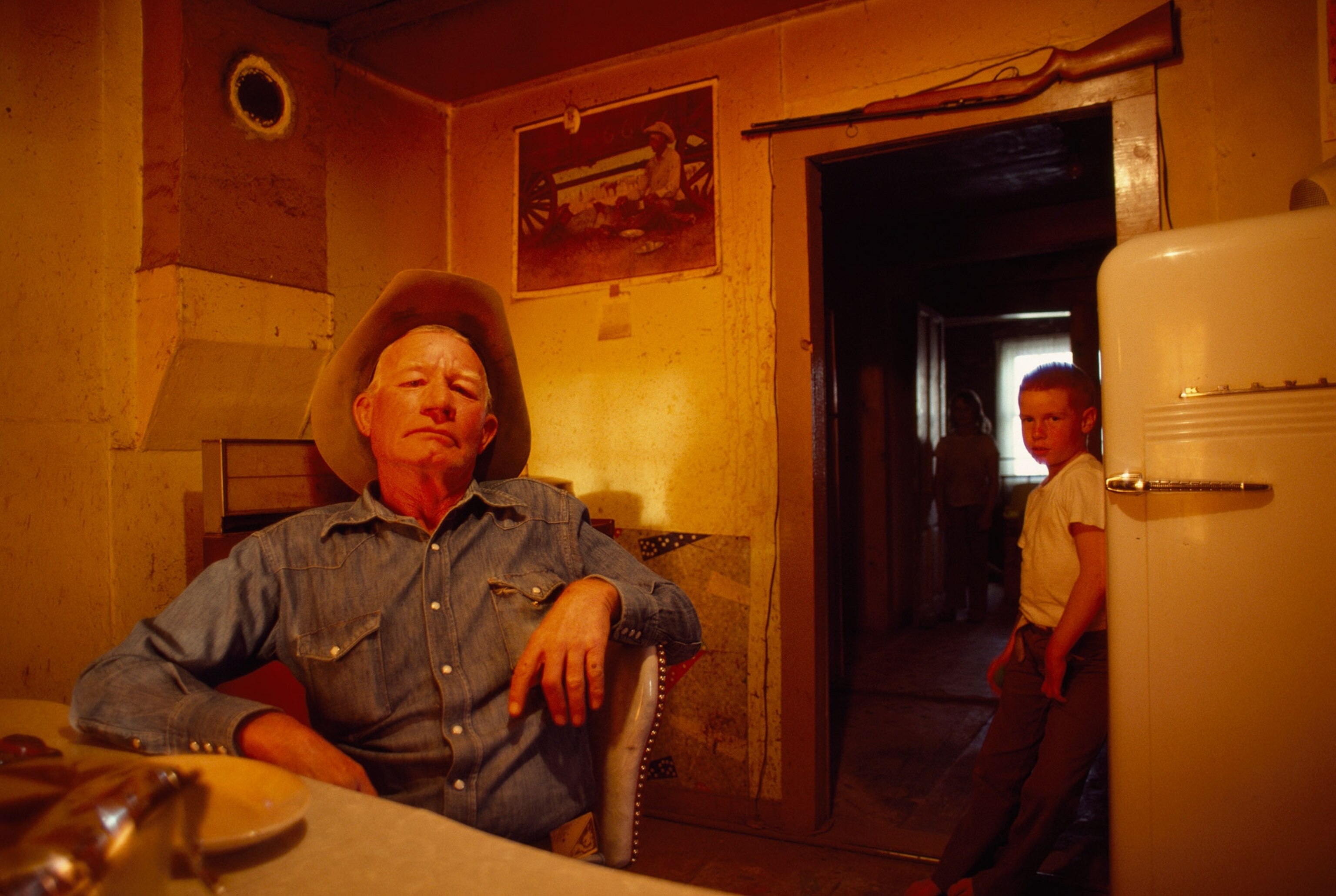 a man and a boy in a kitchen