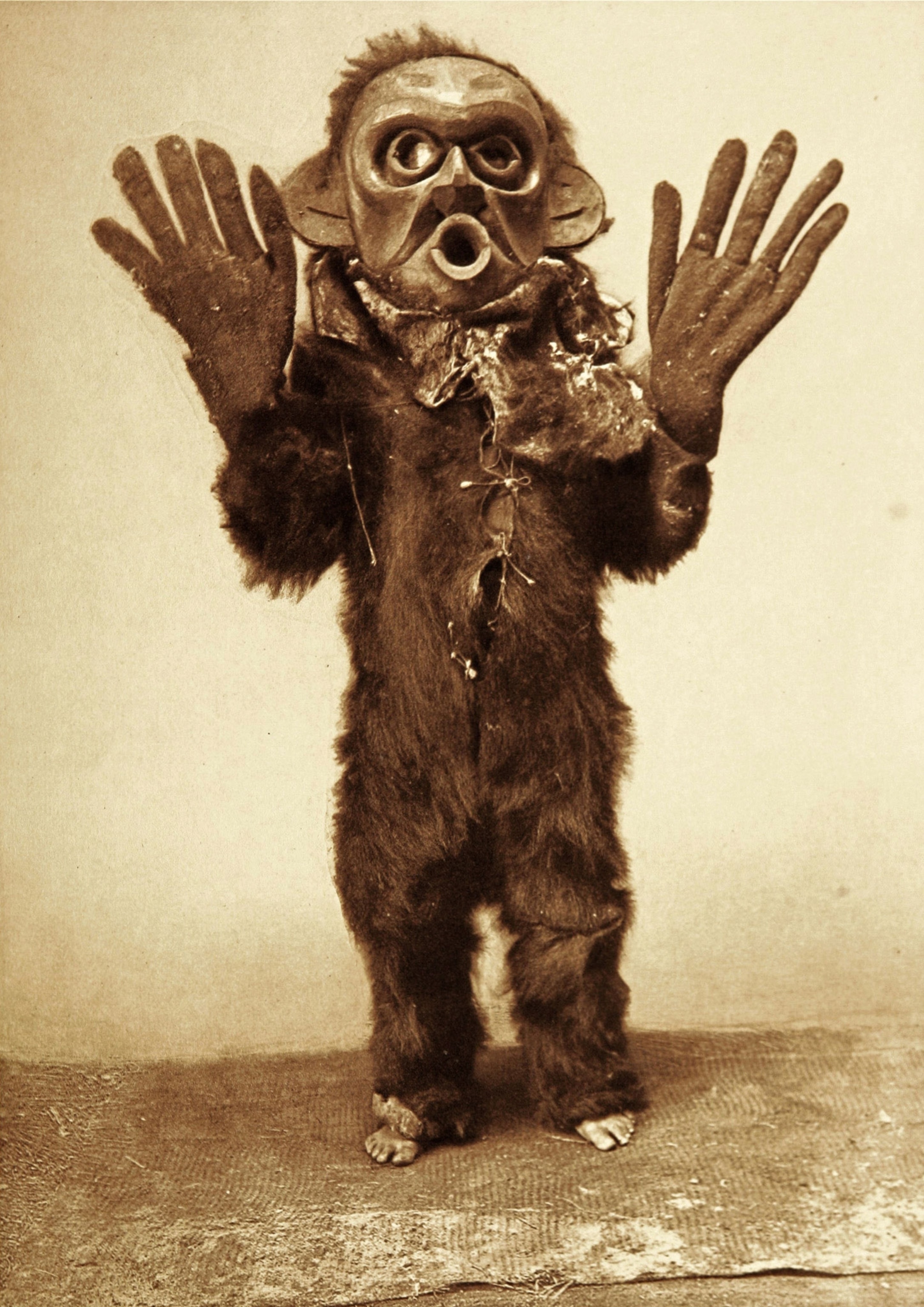 Native American man in ceremonial clothing.