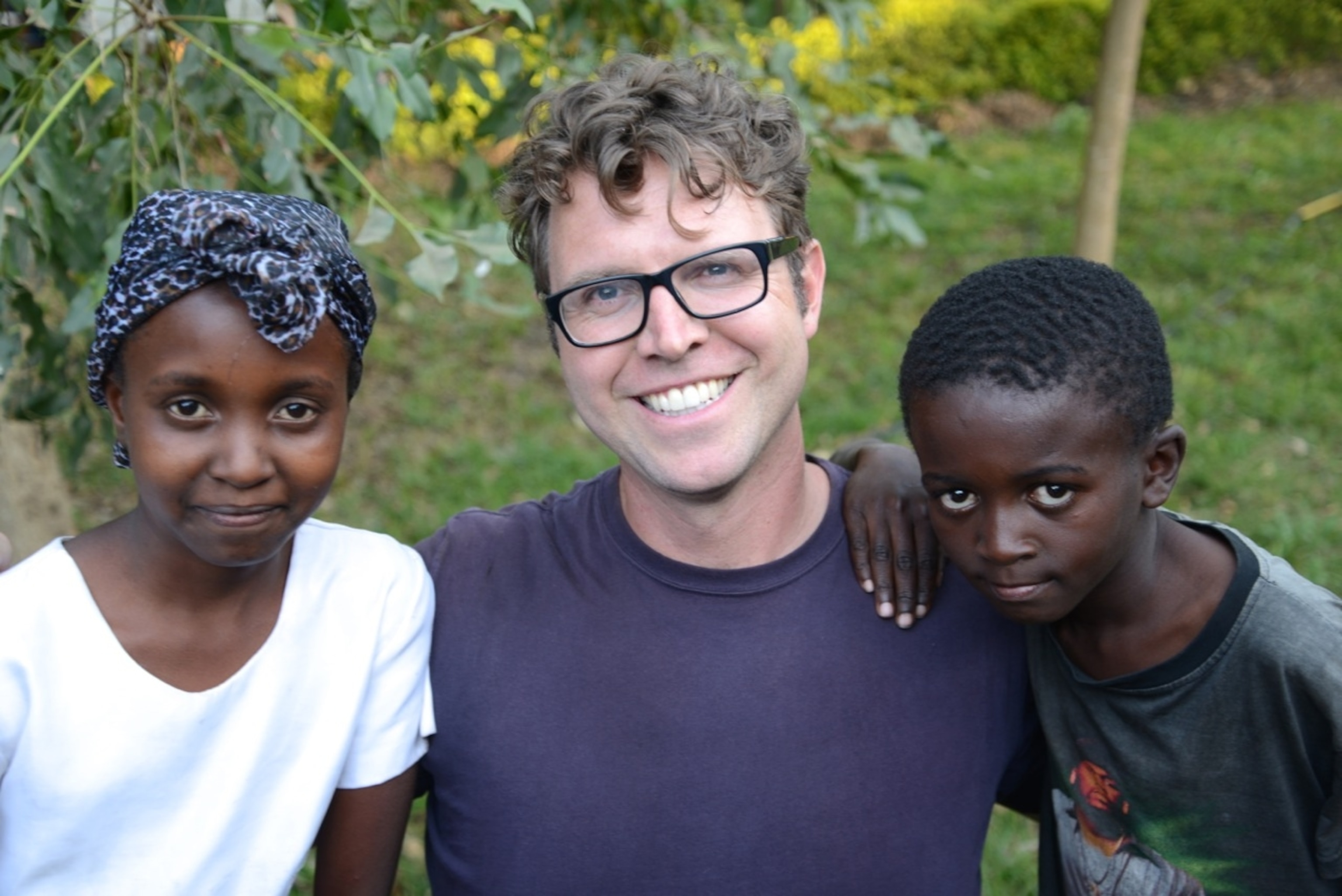 With Loveness (left) and Praygood (right) who I met in Maji ya Chai, Tanzania as part of National Geographic Student Expeditions (Photo by Katie Burns, NGSE)
