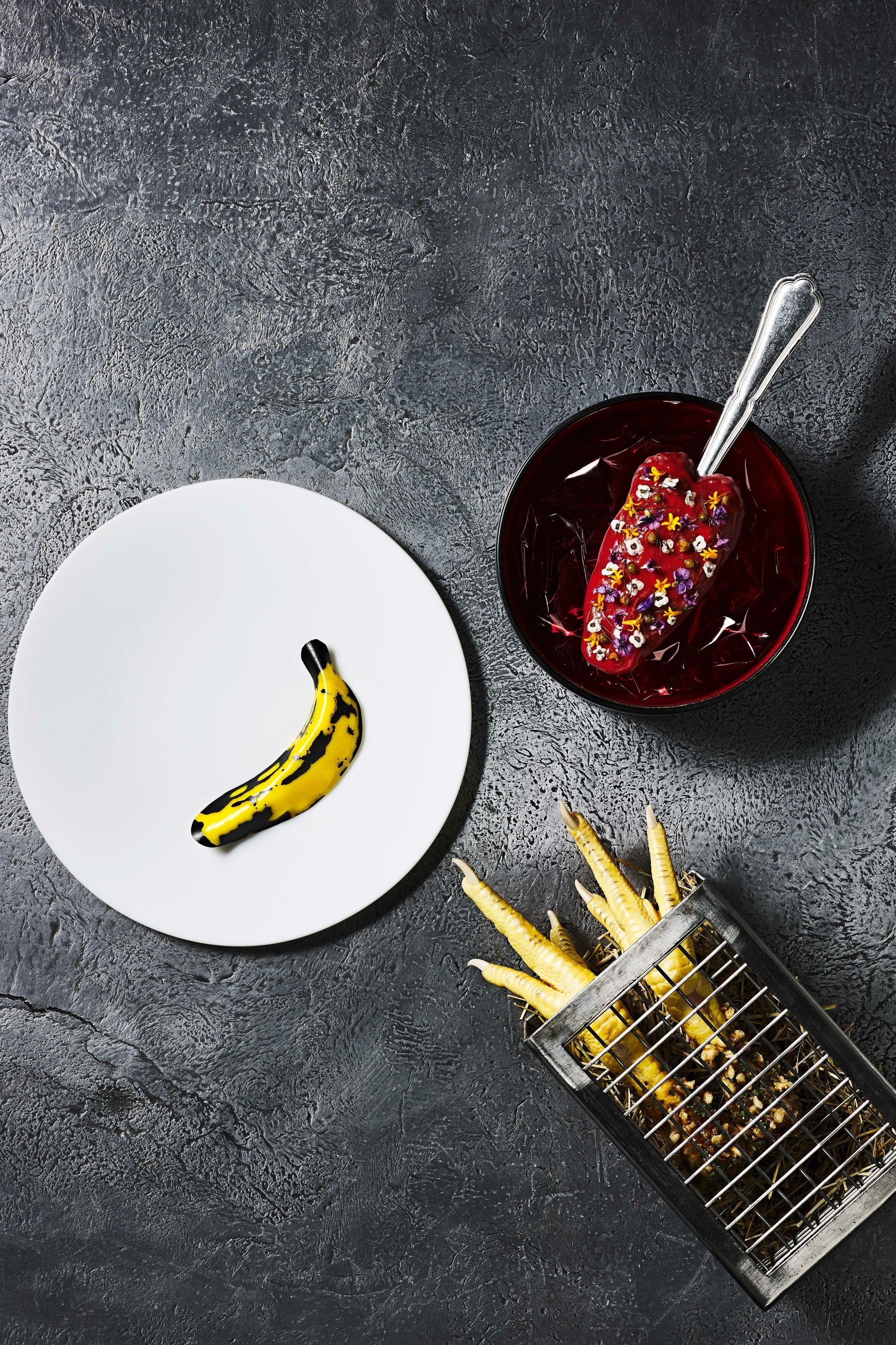 Rasmus Munk's culinary inventions: Tongue Kiss (top right), Burnout Chicken (bottom right), Andy Warhol (banana on the white plate).