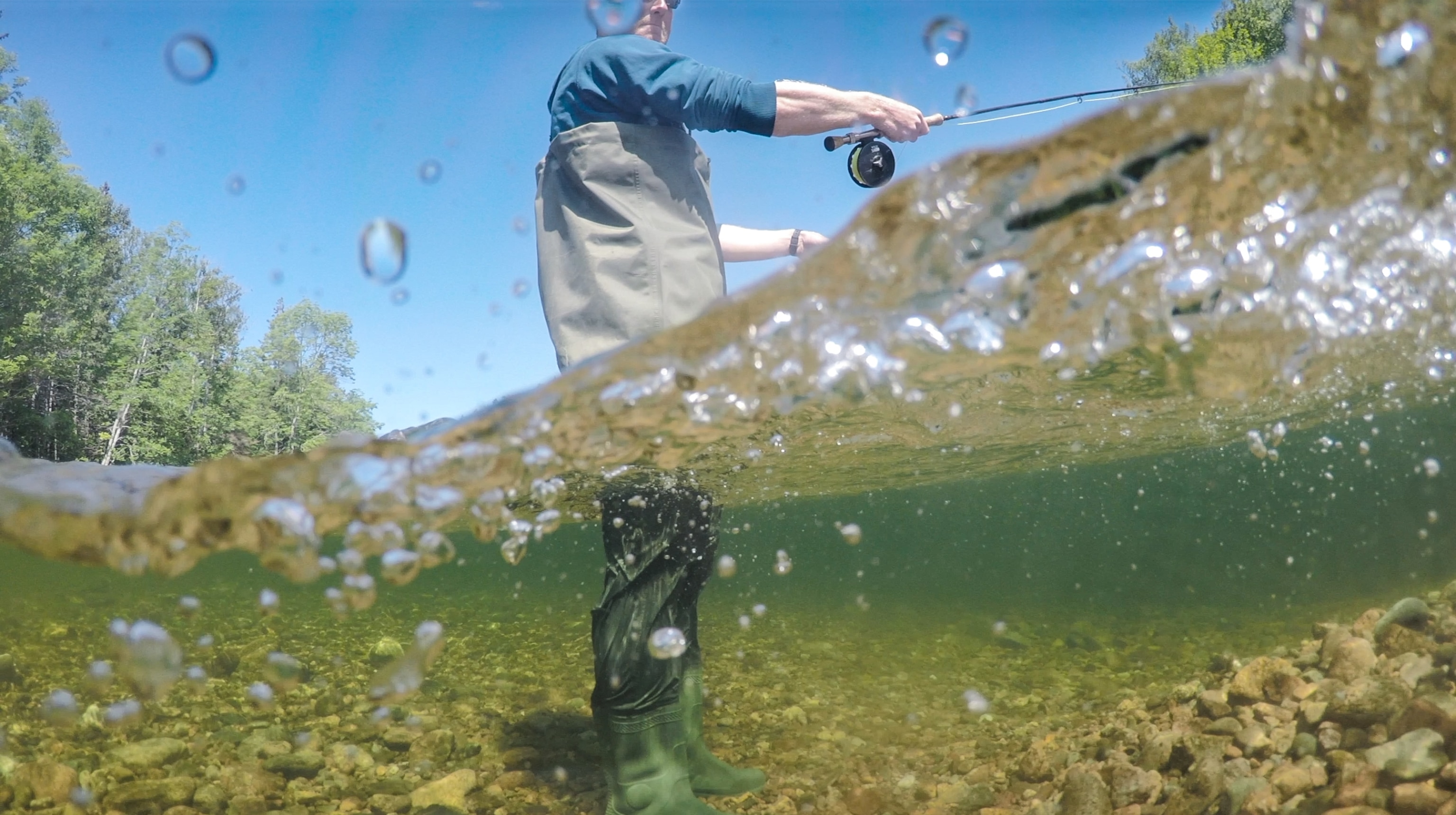 a person fishing in the Margaree River