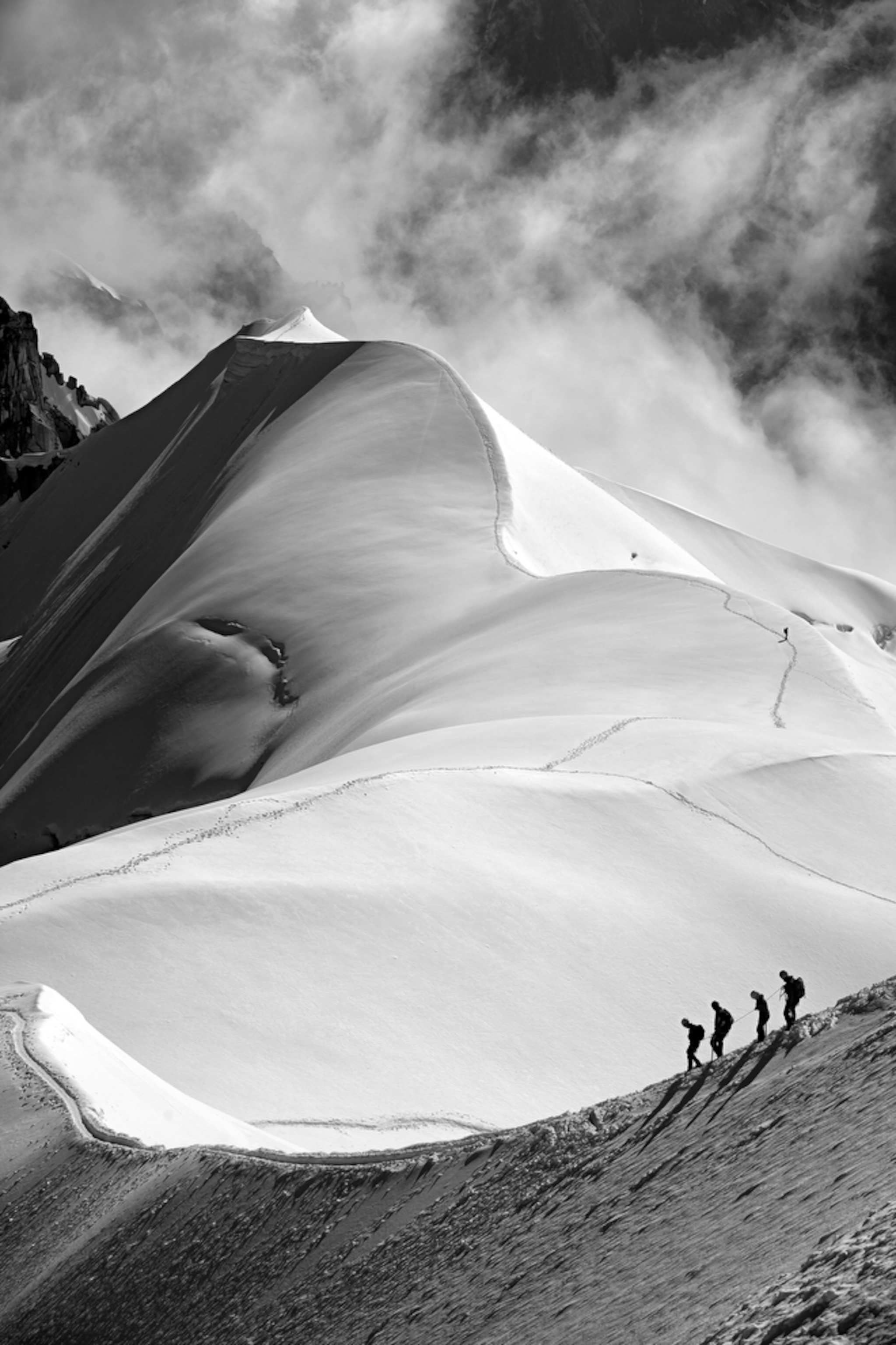 alpinists on Aiguille du Midi in the French Alps.