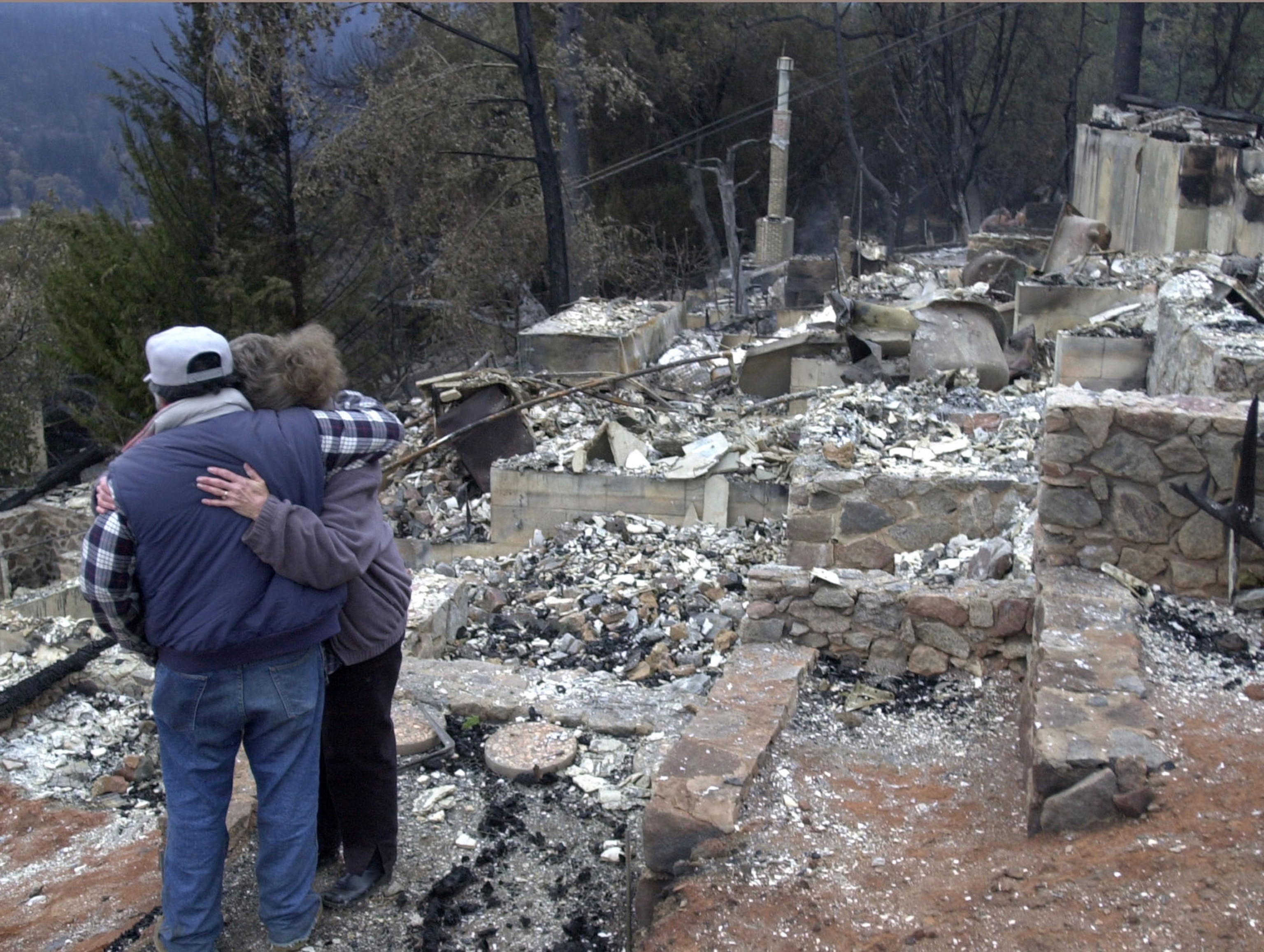 Homes burn in the Smiley Park neighborhood of Running Springs, CA during the Slide Fire in 2007.