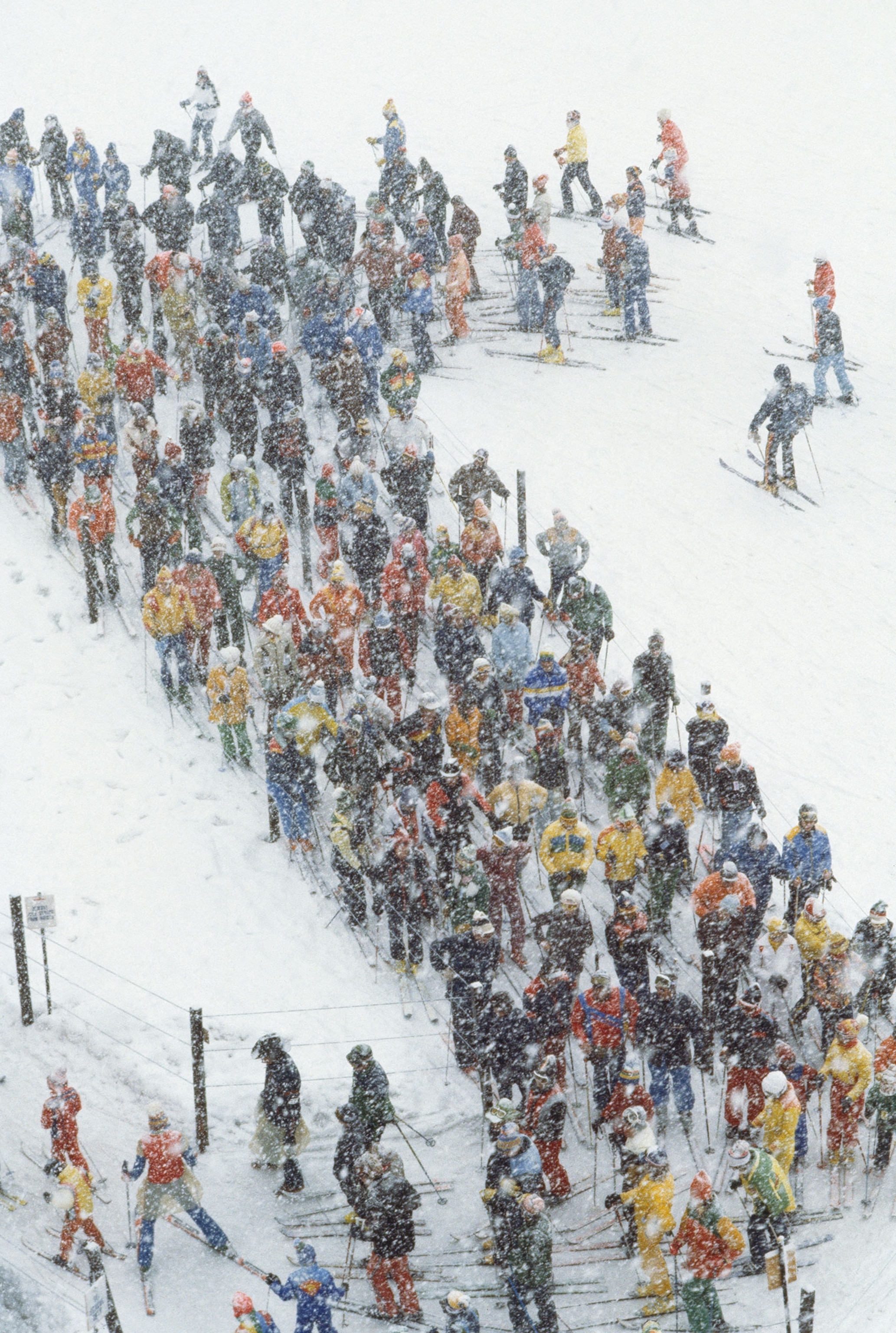 skiers in line for a lift
