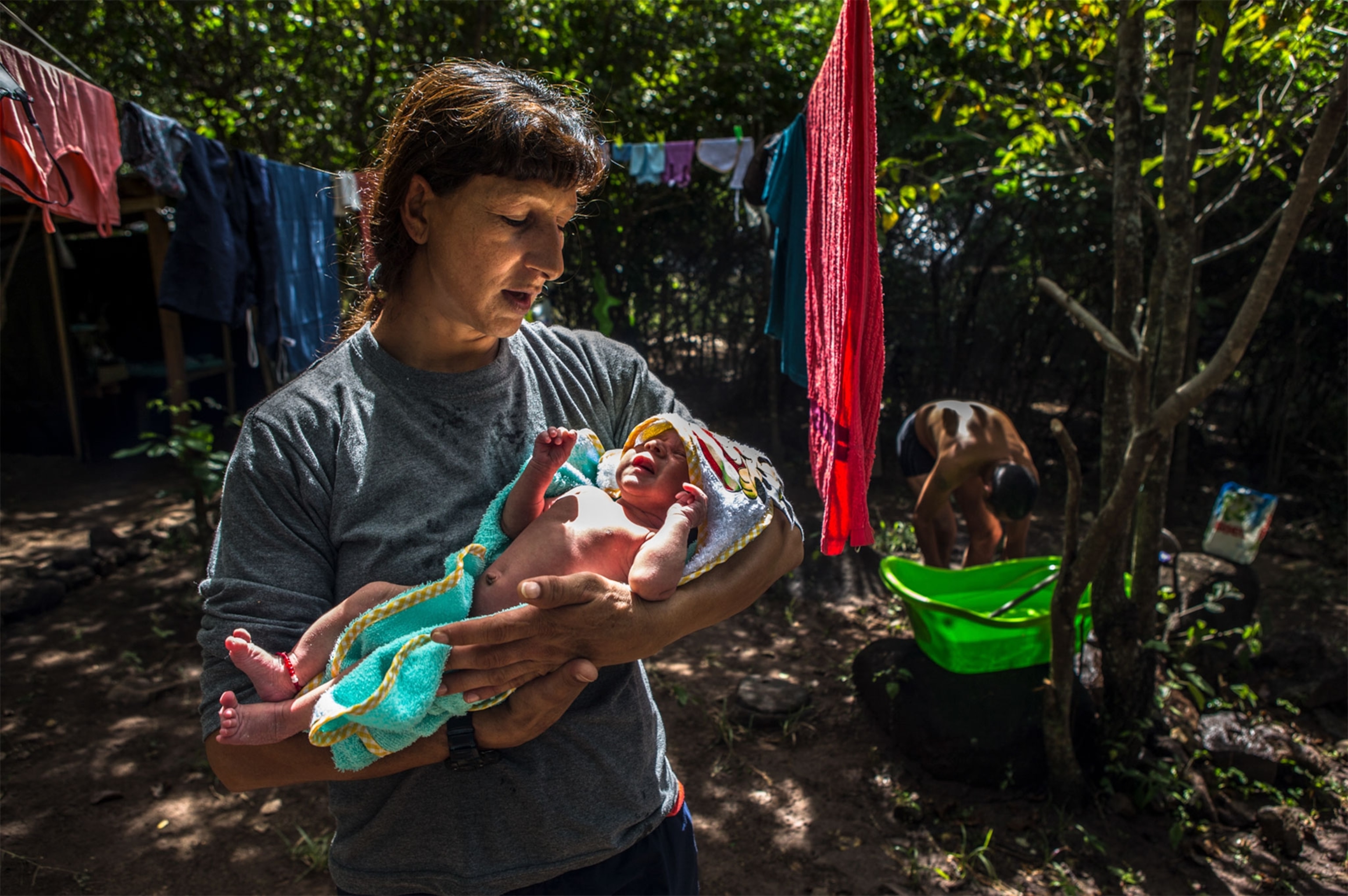 a female FARC fighter with her newborn daughter