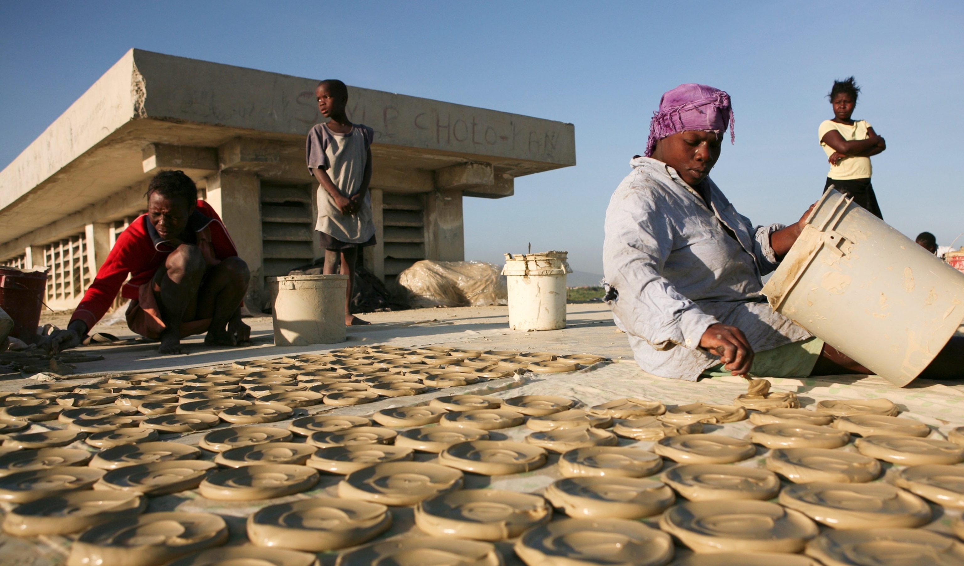 People make mud cookies in Port-au-Prince, Haiti.
