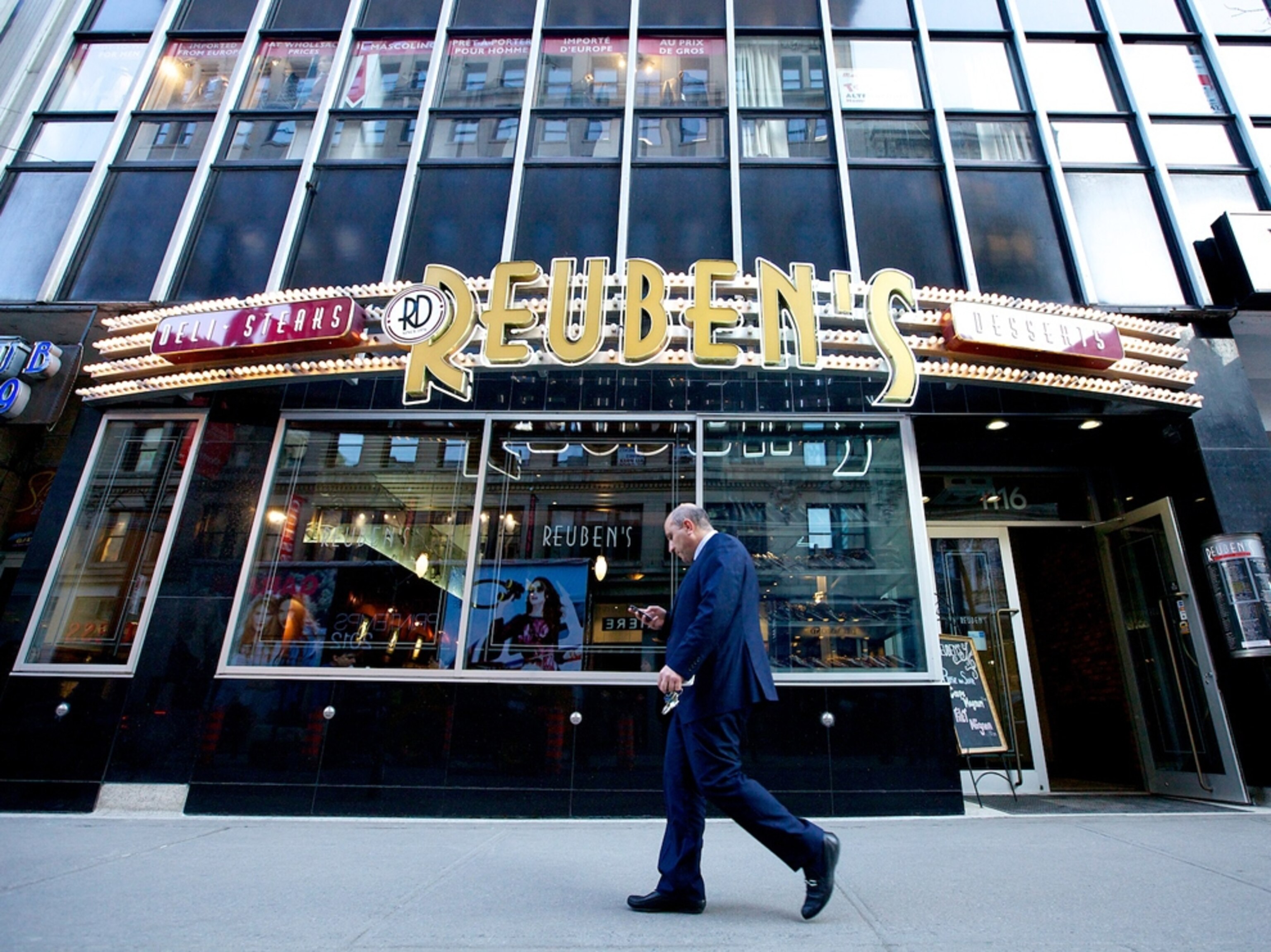 Man walks by a restaurant in Montreal