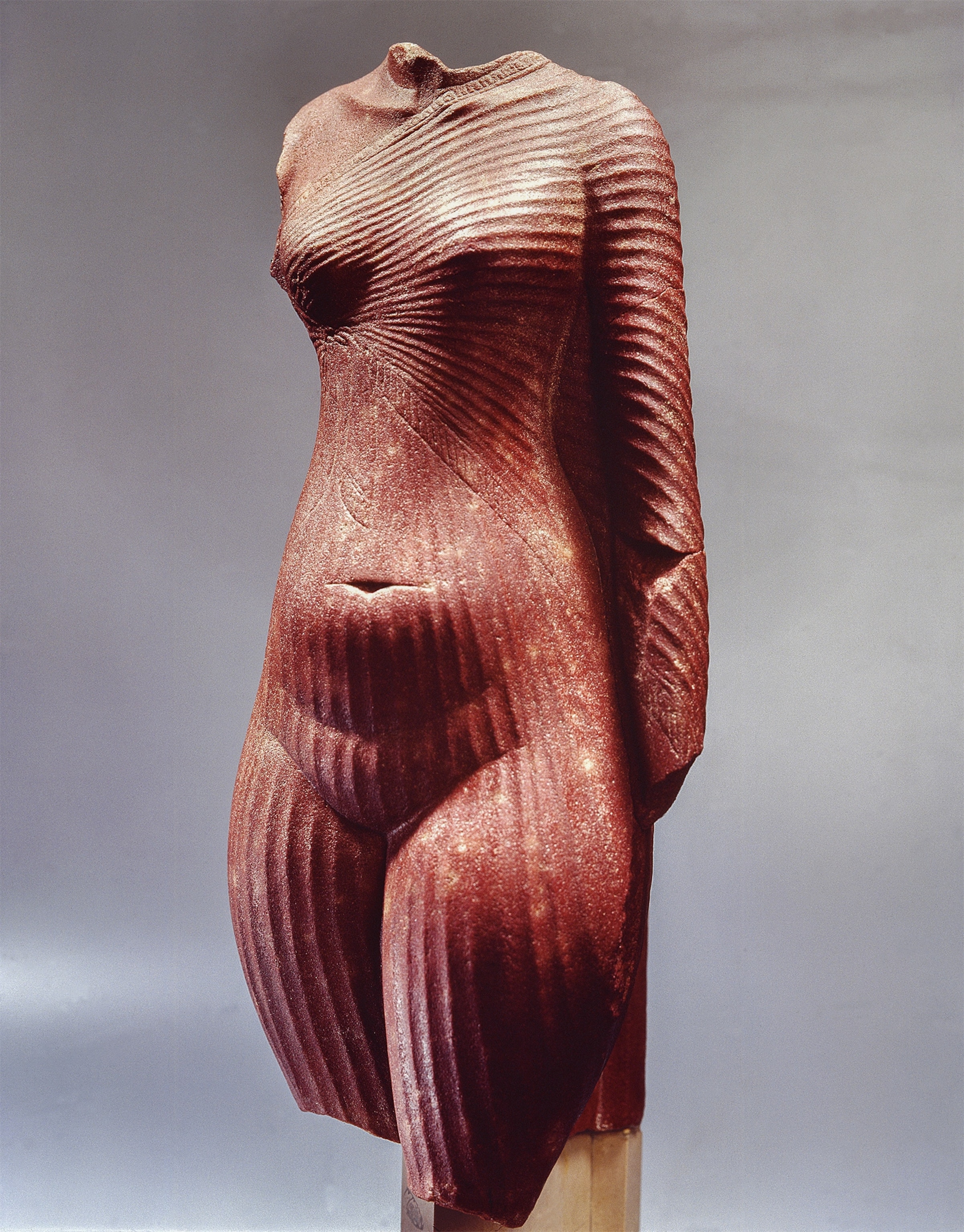 Meticulously crafted, a statue from the Amarna period depicts a woman wearing a close-fitting, pleated linen dress. It is believed to represent Nefertiti or perhaps one of her daughters.