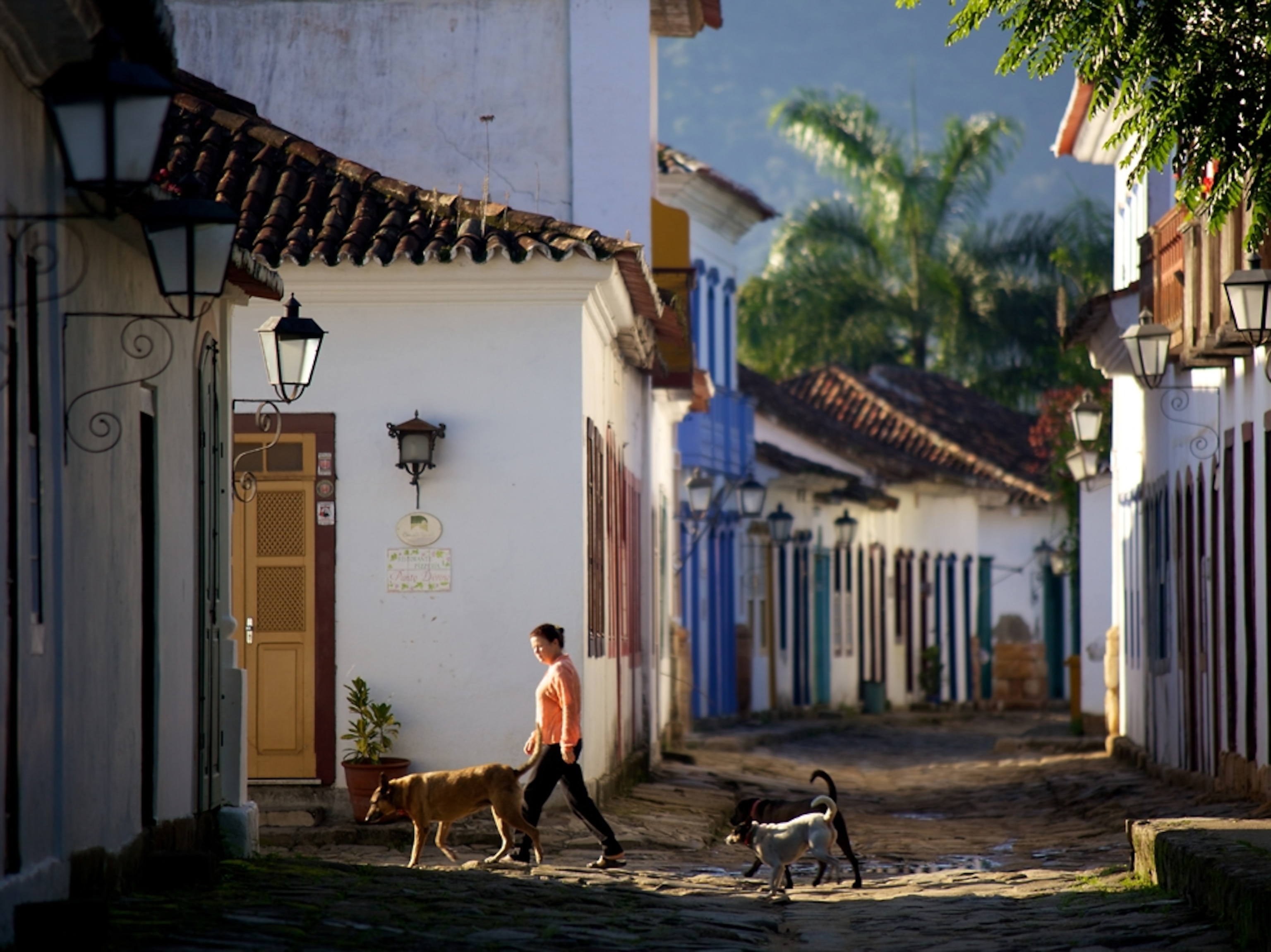 Woman walking on streets of Parati