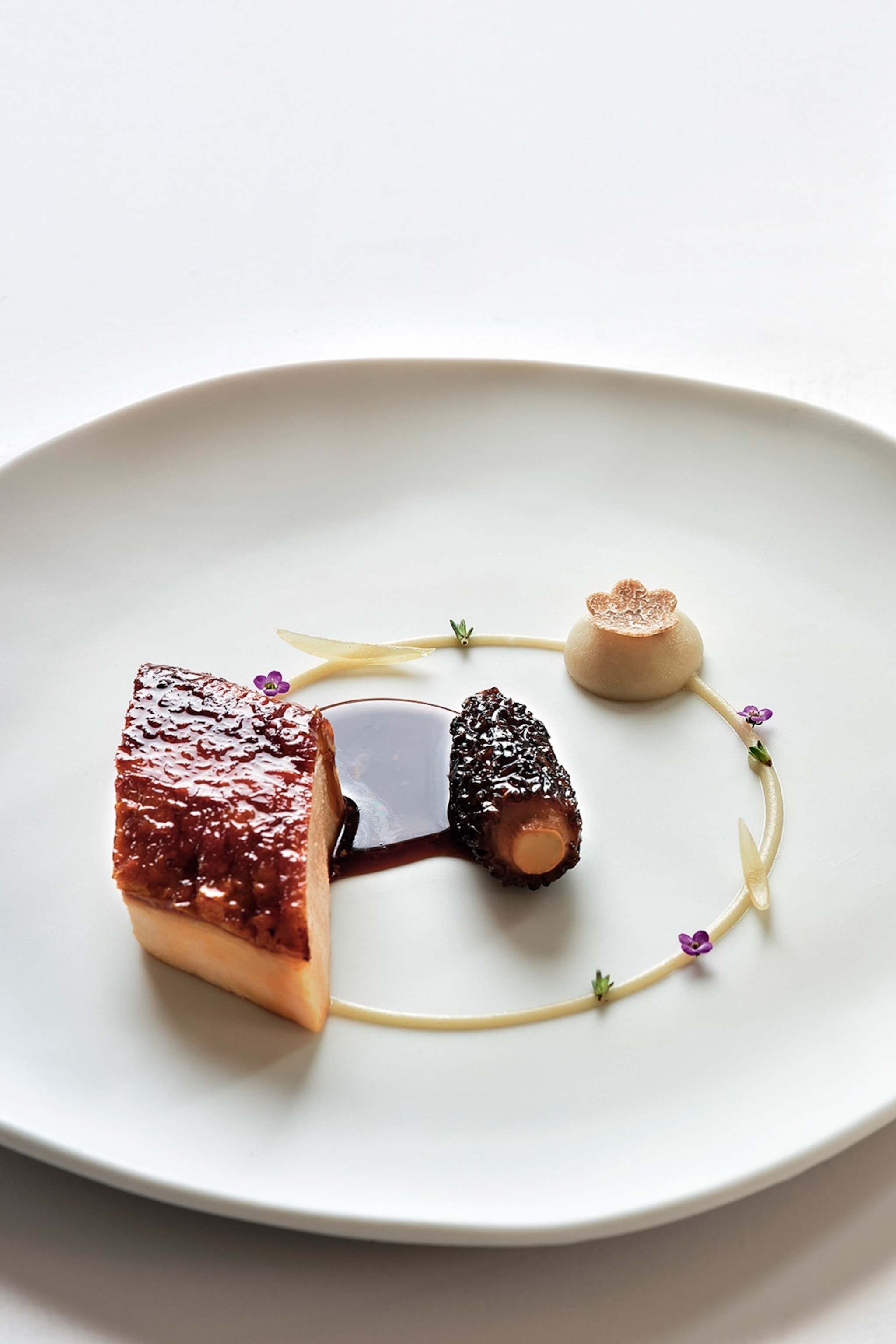 A close-up of a plate with small bites from a fine dining restaurant.